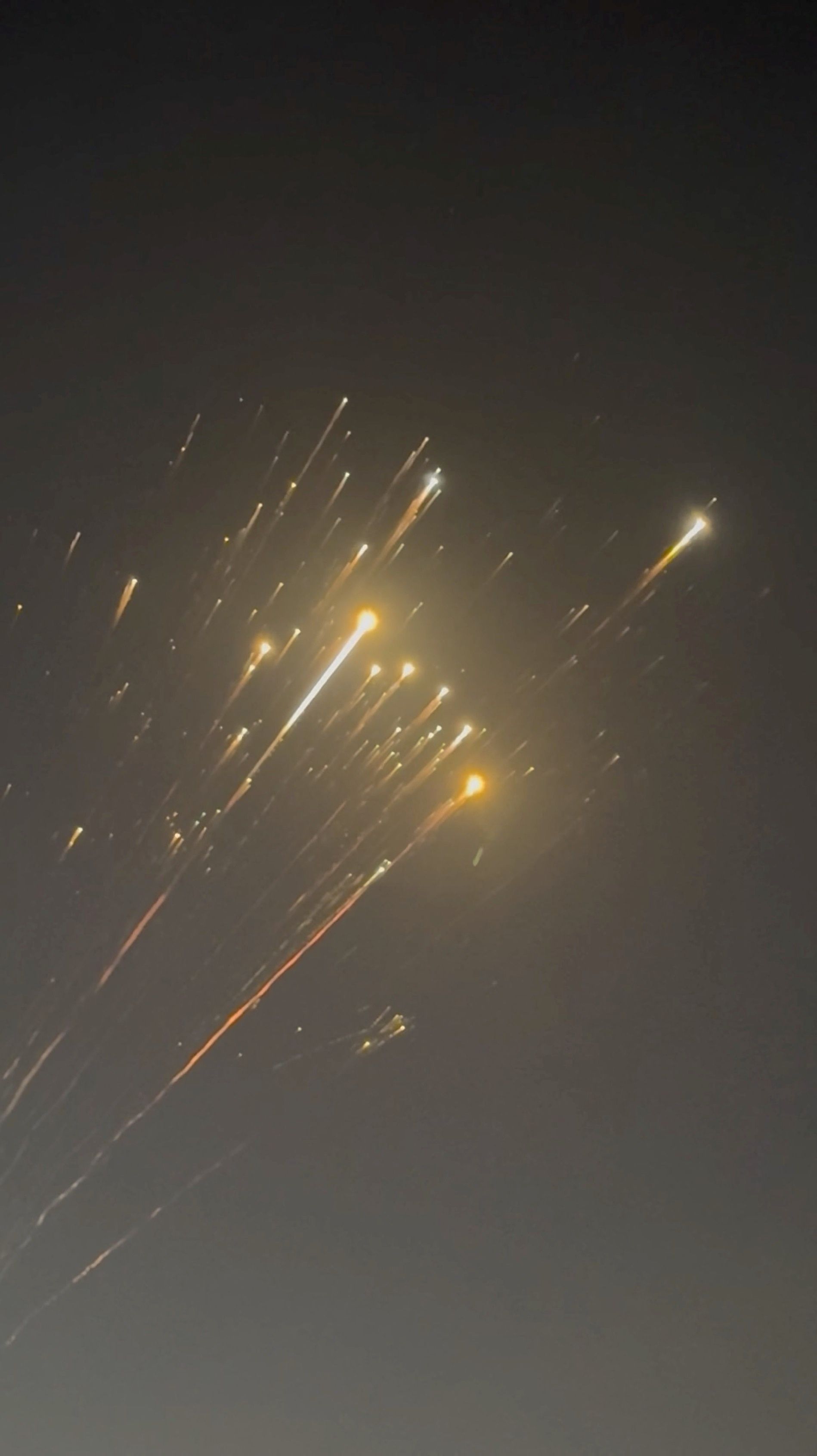 Debris streaks through the sky over Hog Cay, Bahamas, after SpaceX's Starship spacecraft tumbled and exploded in space. Screengrab from X video: @GeneDoctorB via Reuters