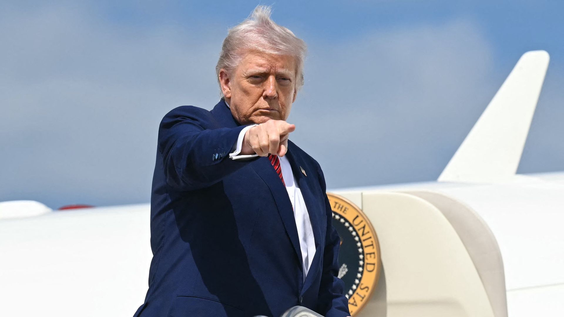 President Trump points as he boards Air Force One at Joint Base Andrews in Maryland on May 23, 2025.