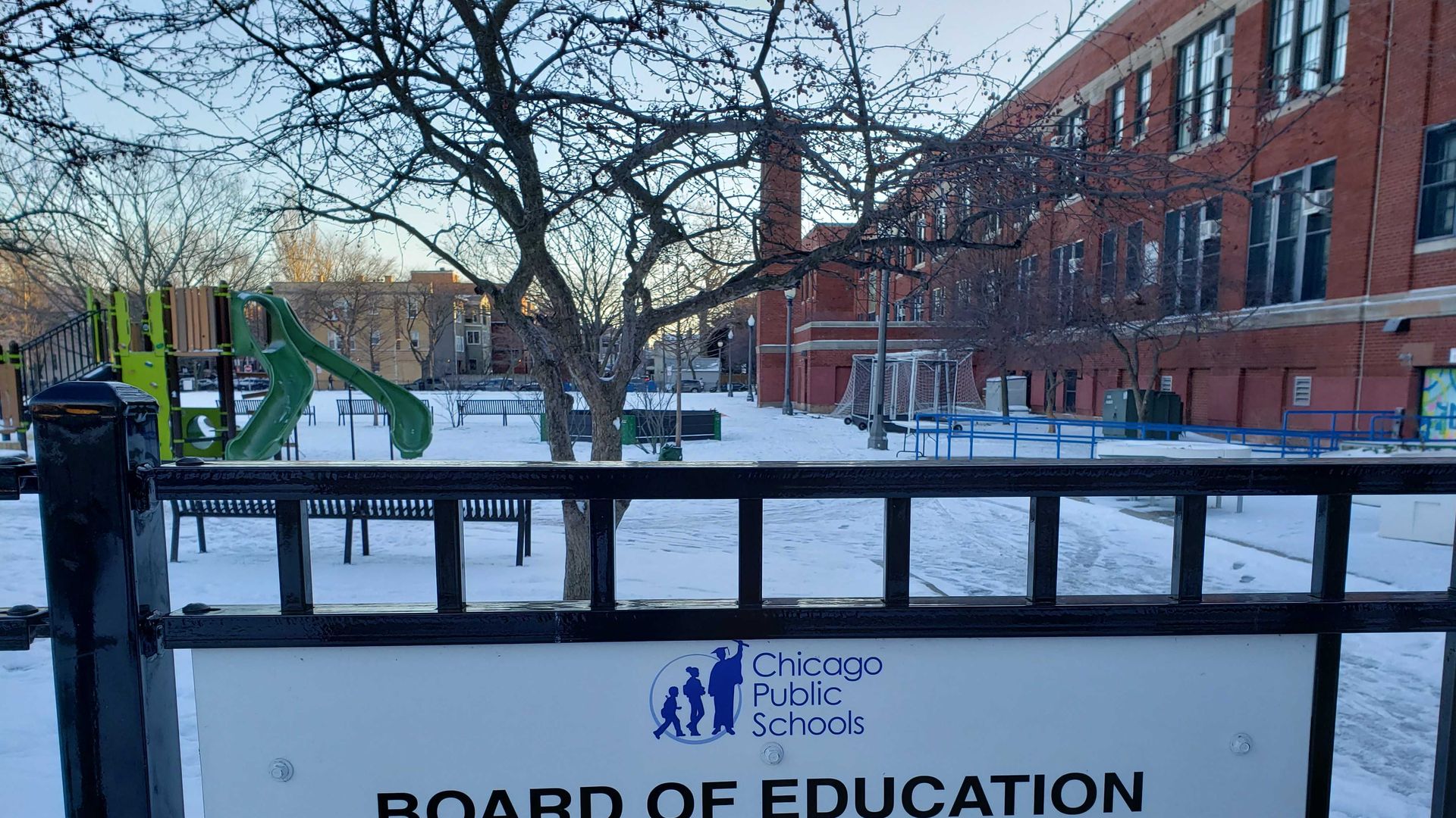 A photo of a sign at a playground. 