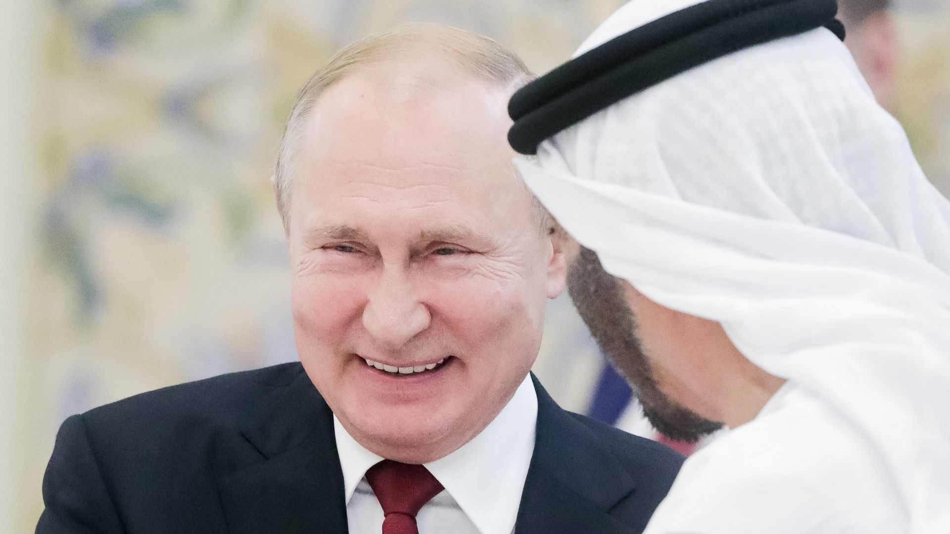 Vladimir Putin laughing