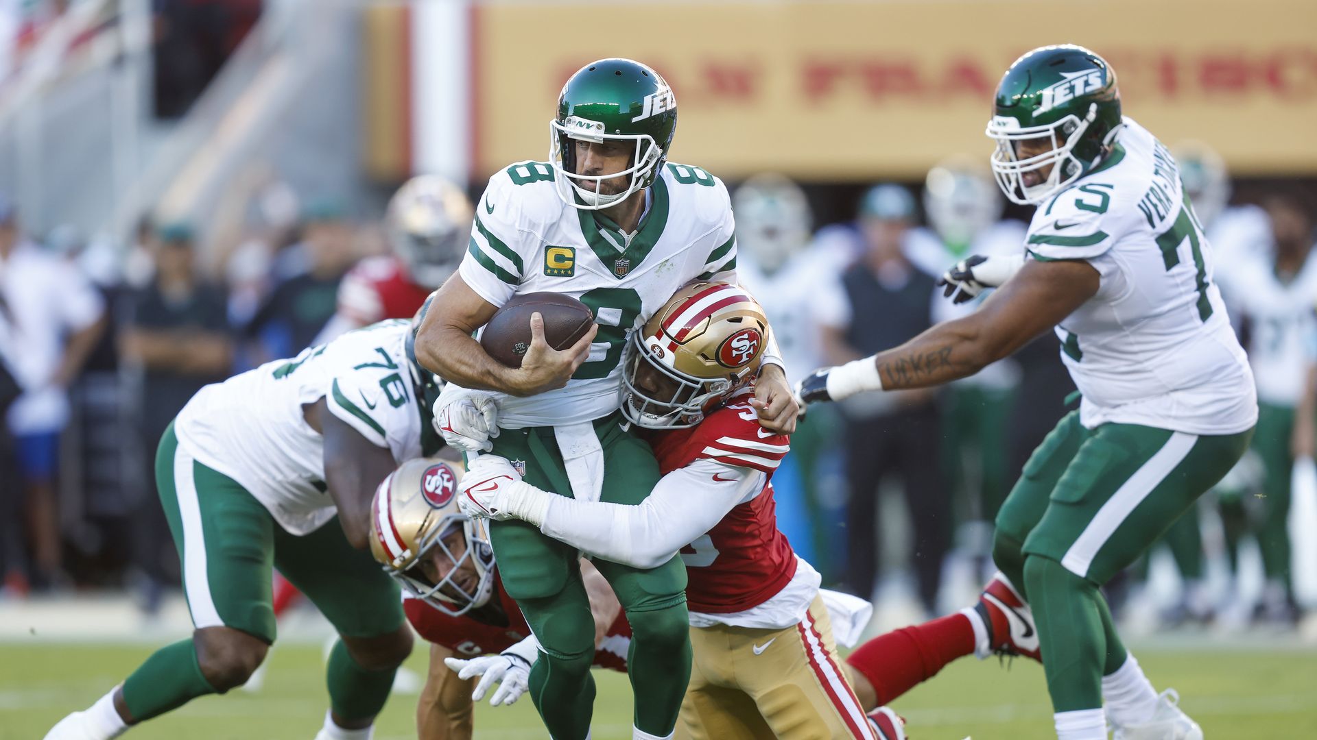 SANTA CLARA, CALIFORNIA - SEPTEMBER 09: Quarterback Aaron Rodgers #8 of the New York Jets is sacked by defensive end Leonard Floyd #56 of the San Francisco 49ers during the second quarter at Levi's Stadium on September 09, 2024 in Santa Clara, California. (Photo by Lachlan Cunningham/Getty Images)