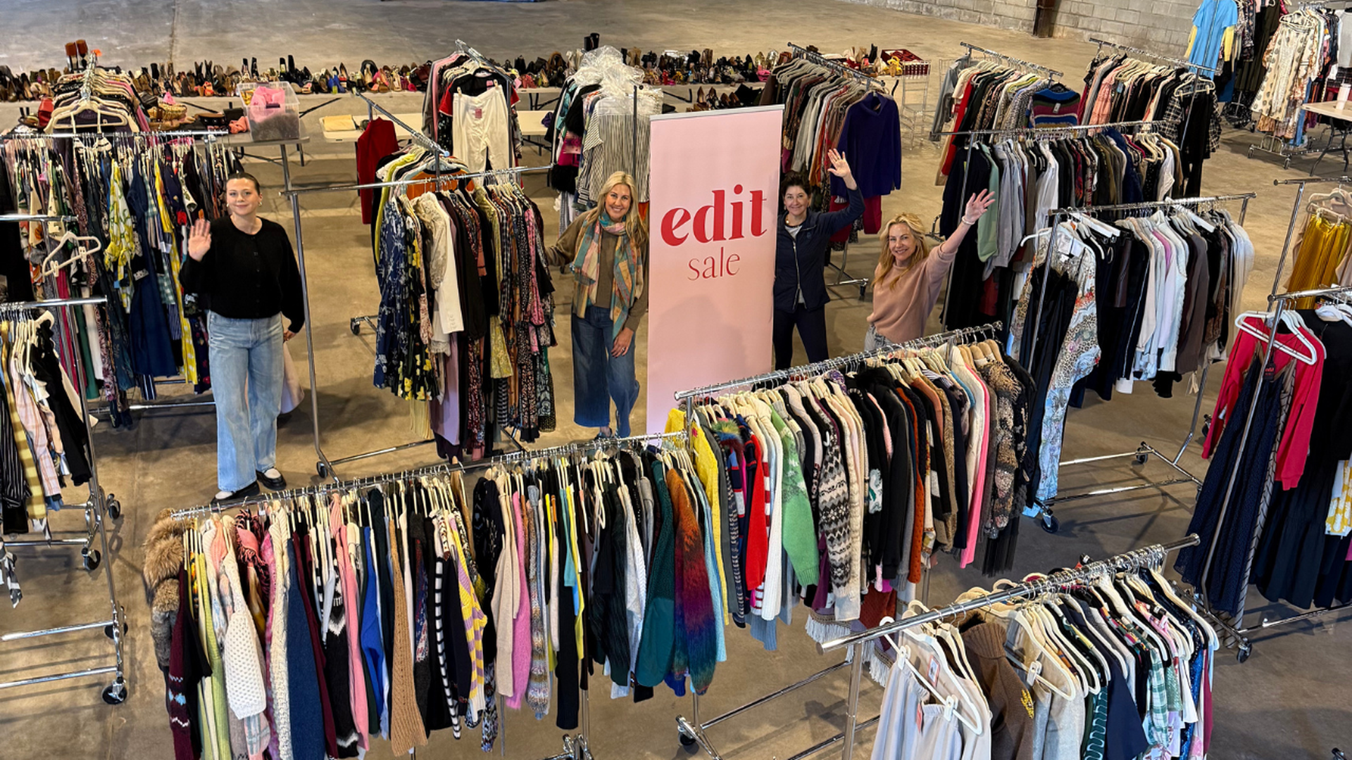 warehouse filled with clothing racks