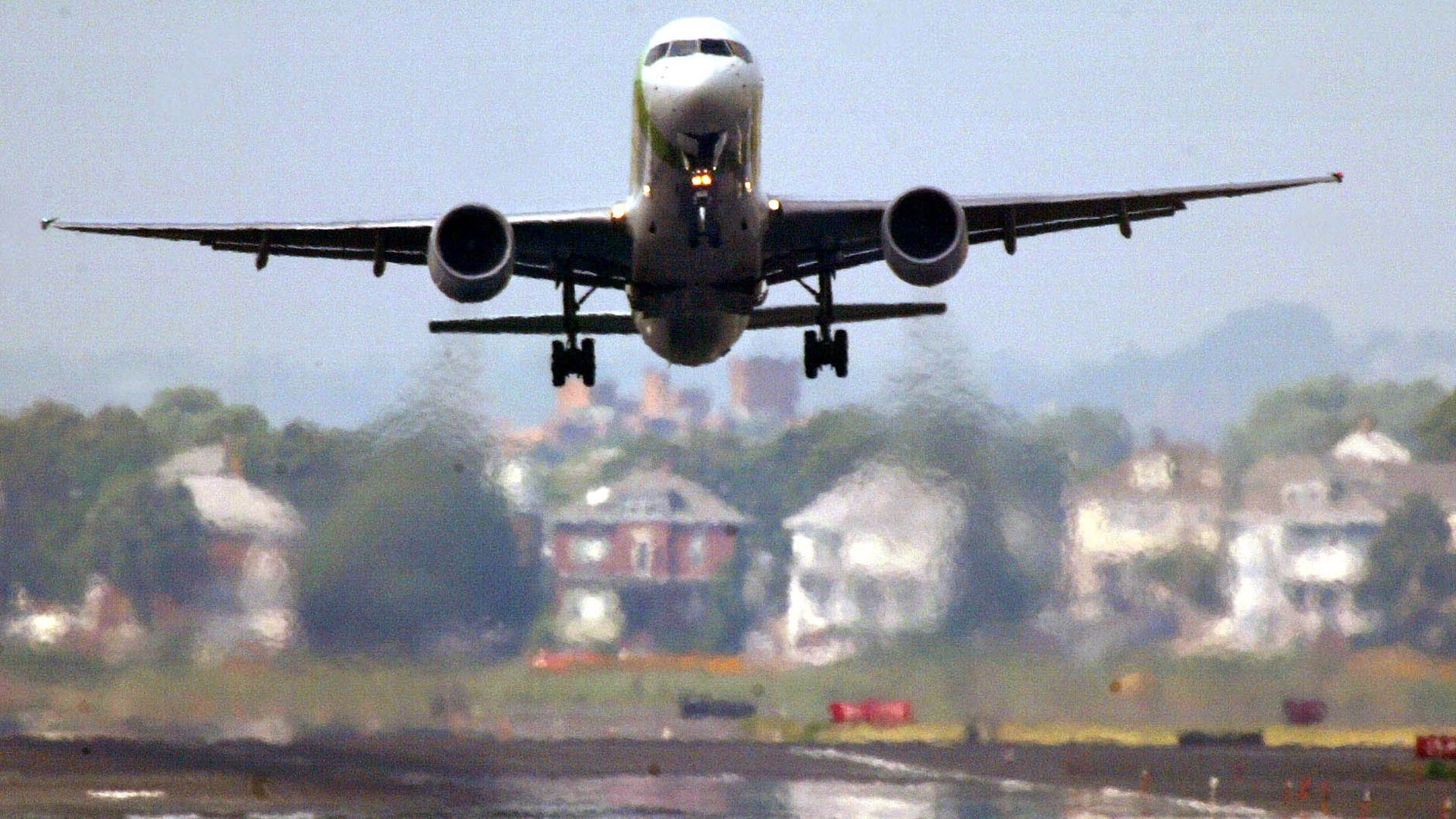 An aircraft departs from Boston Logan International Airport on August 9, 2005.