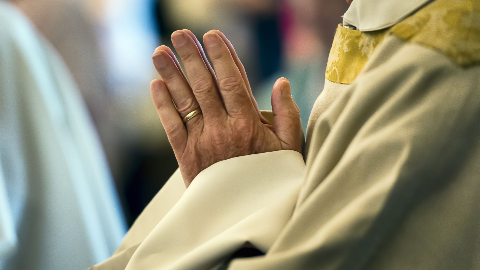 A priest's hands in prayer