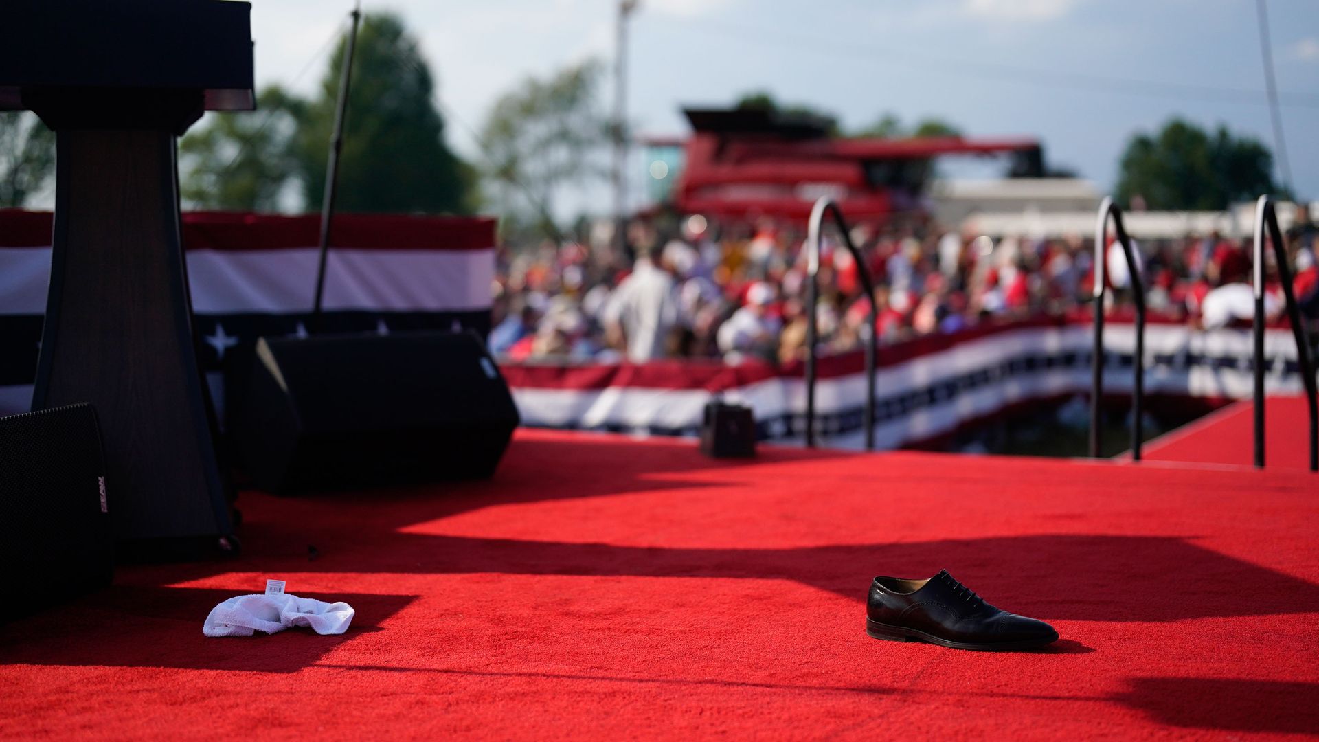 A lone shoe is seen on the stage of President Trump's rally after a shooting took place. 