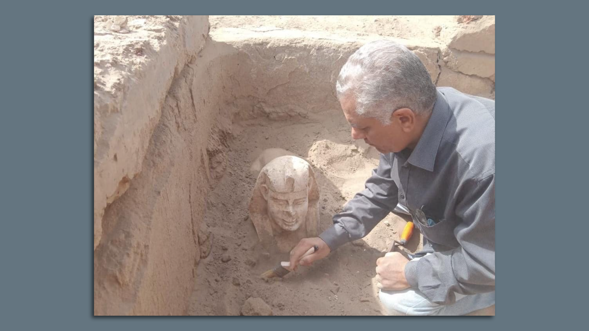 Archeologist unearths a statue of the sphinx