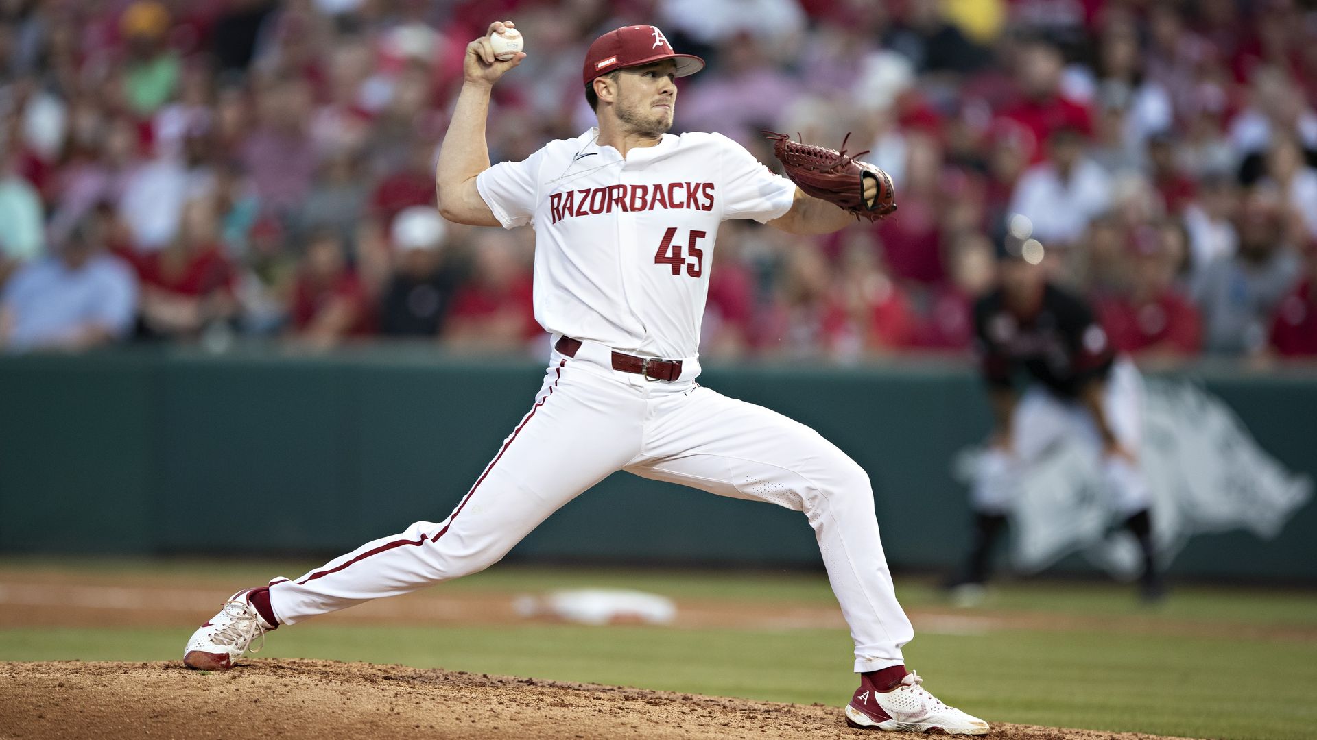 Kevin Kopps #45 of the Arkansas Razorbacks pitches