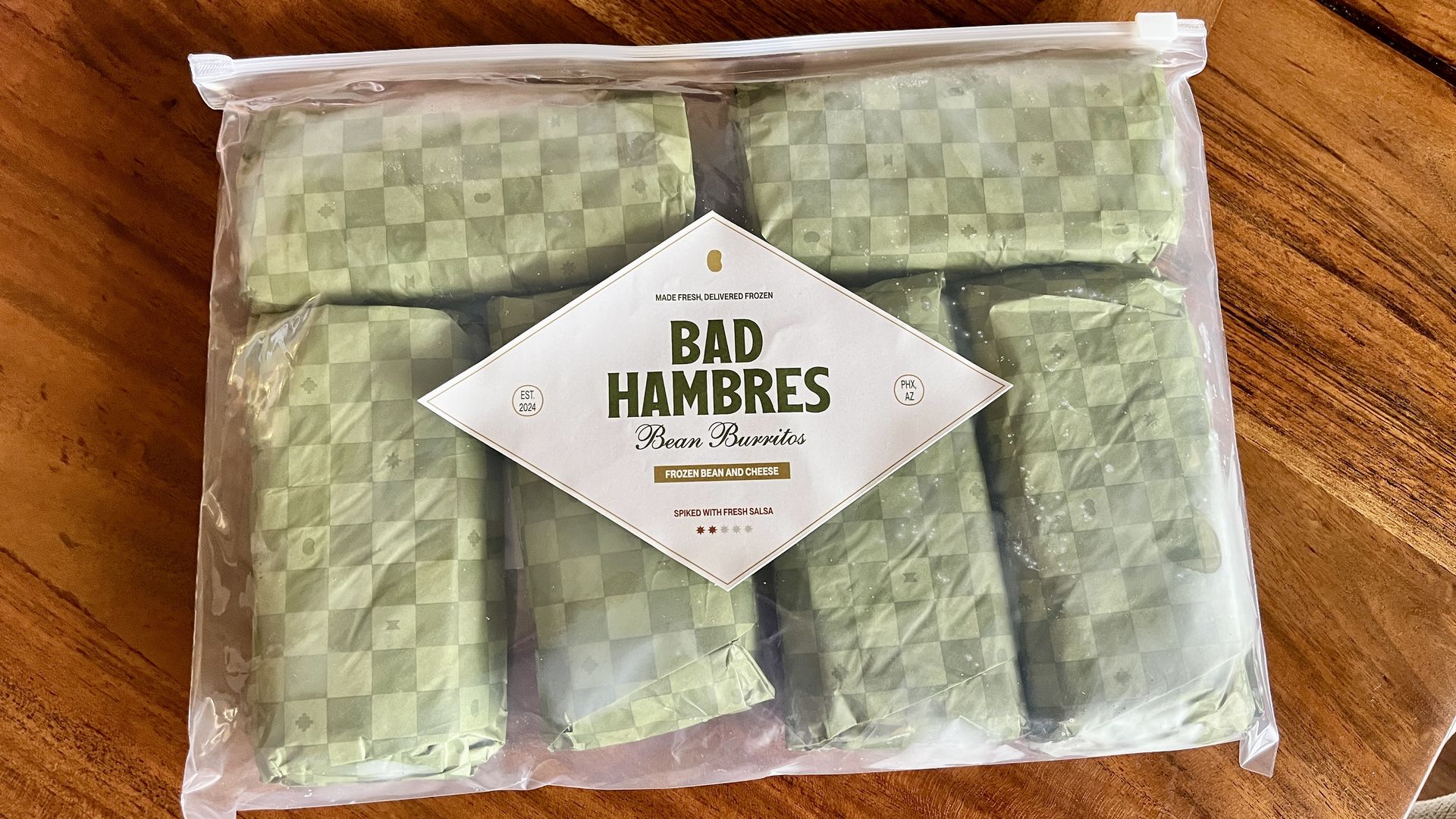 A bag of burritos that says, "Bad Hambres."