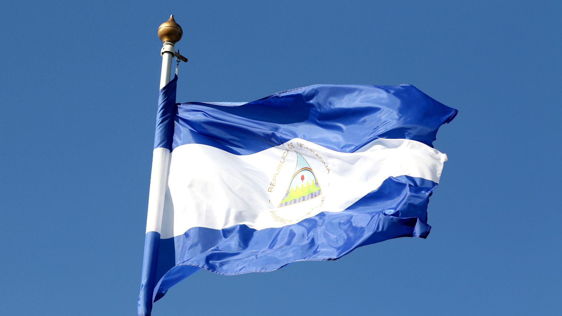 The Nicaragua flies against a blue sky