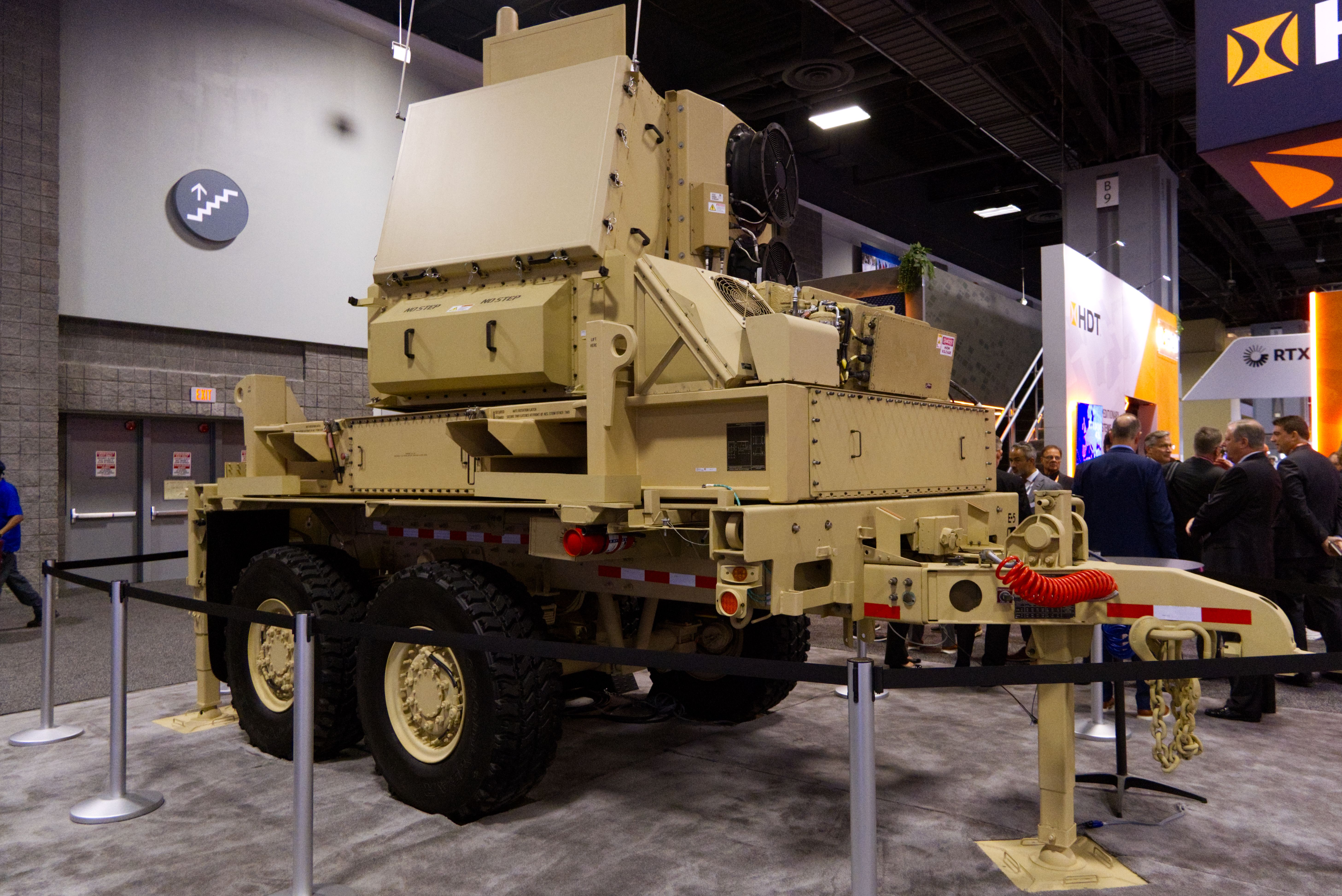 A large, spinning radar, khaki in color, is seen on the show floor of AUSA.