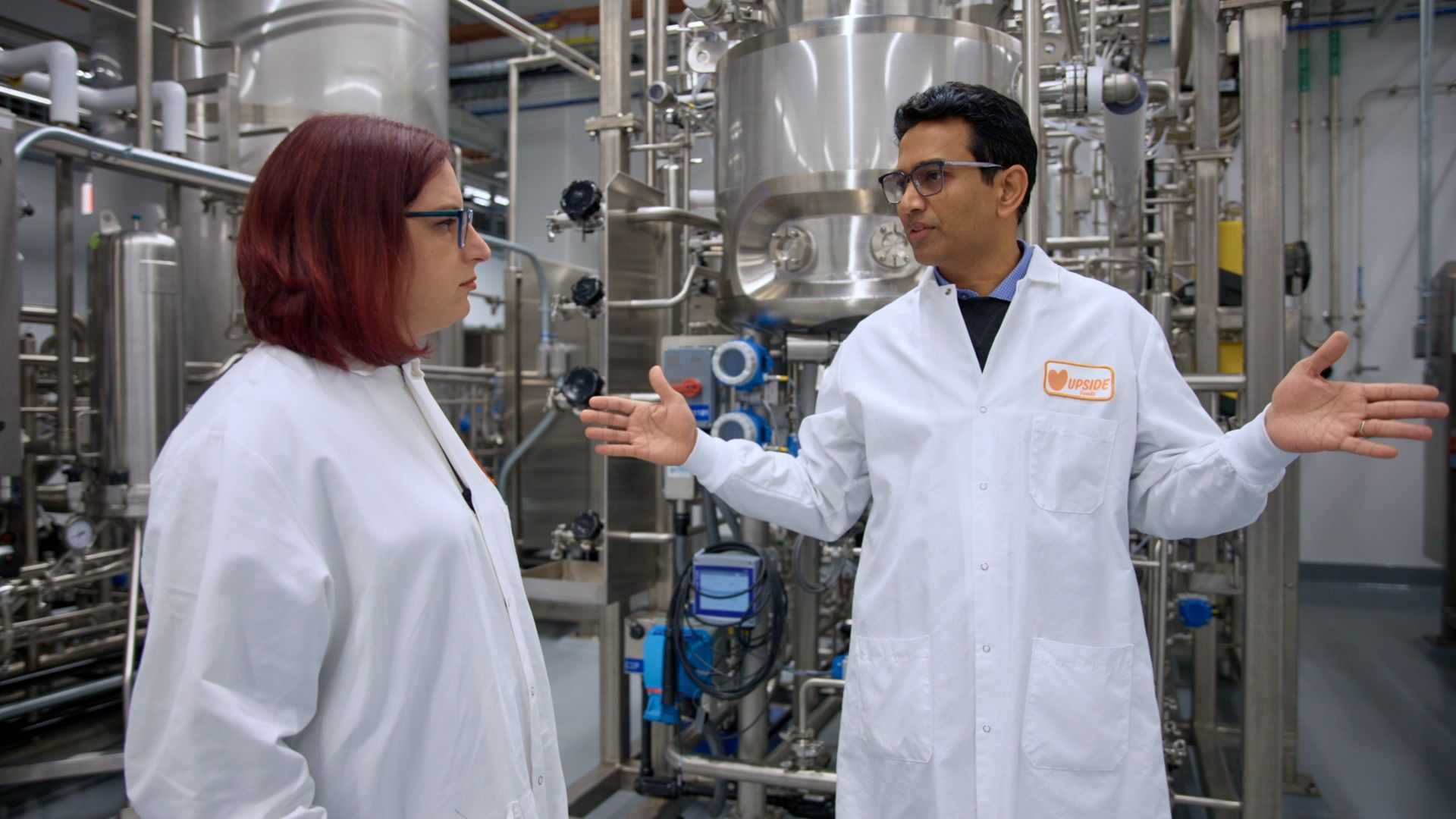 Upside Foods CEO Uma Valeti shows Axios' Ina Fried the process for creating lab-grown meat.