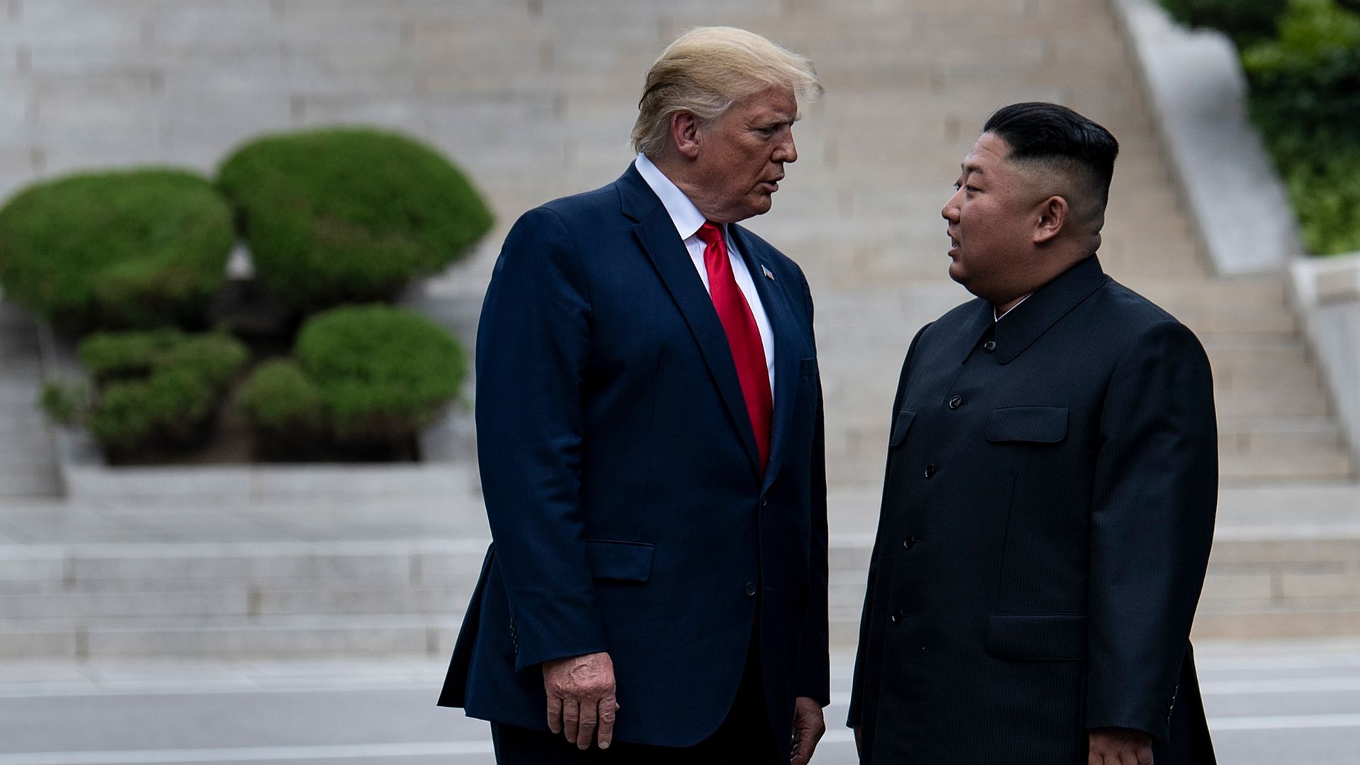 President Donald Trump and North Korea's leader Kim Jong-un stand on North Korean soil.