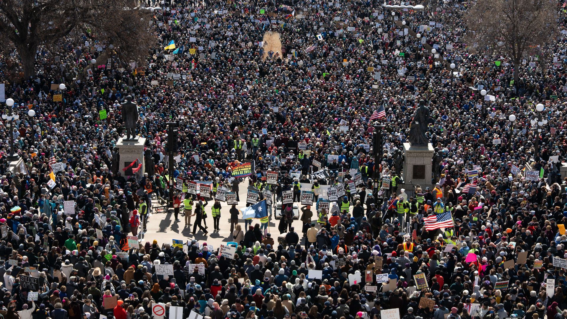 A large crowd attending a rally outside the Minnesota State Capitol