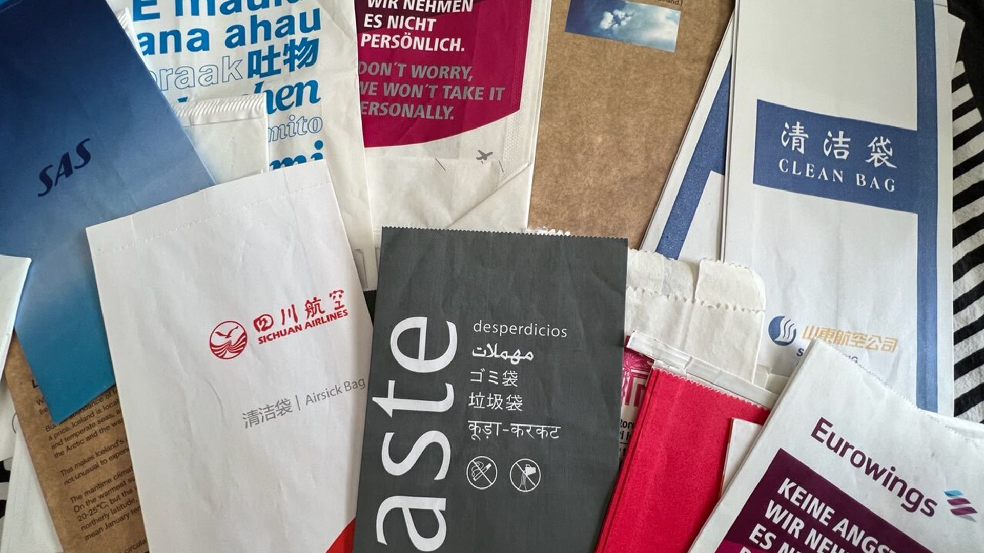 A collection of vomit bags from airplanes.