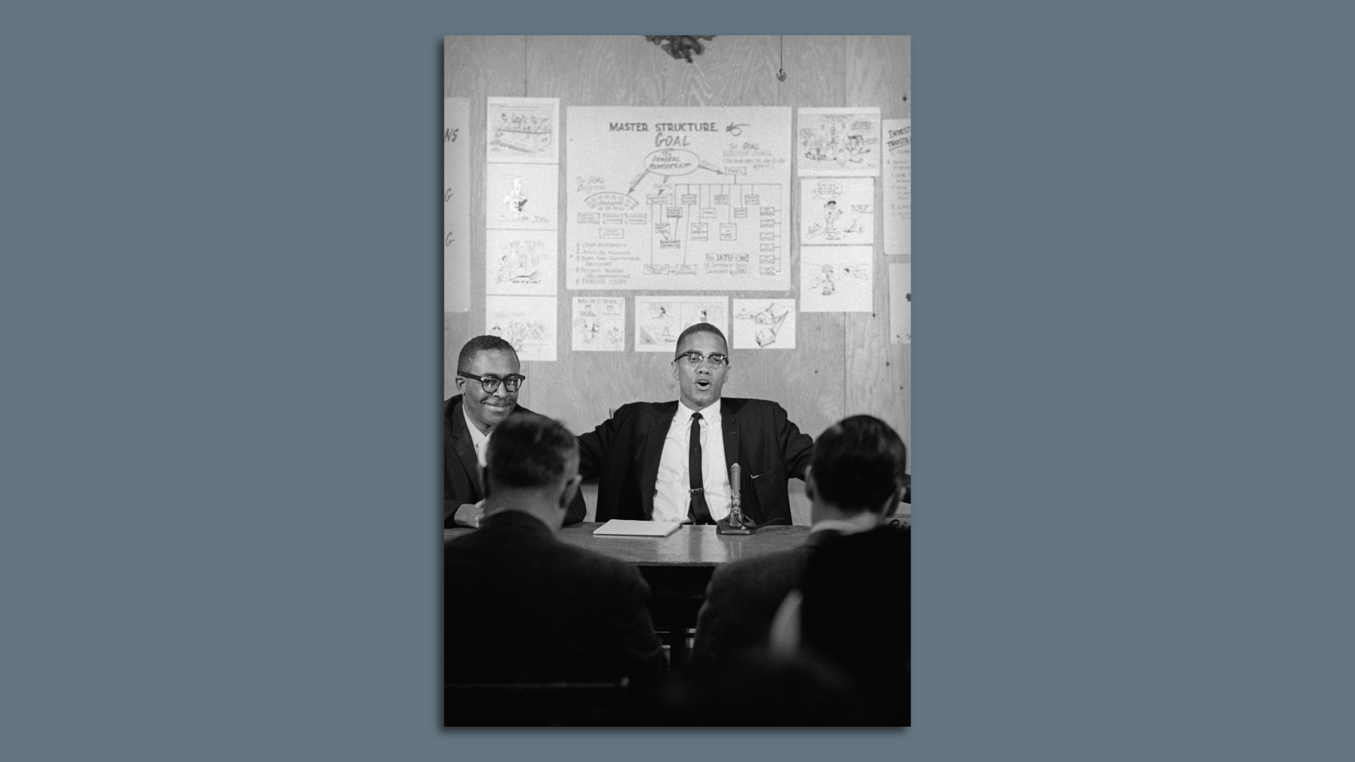 Malcolm X giving a press conference at the offices of the Group on Advanced Leadership (GOAL) in Detroit, Michigan, 12th April 1964. Later that day, he twice gave a version of his 'The Ballot or the Bullet' speech - at a legal fund rally for GOAL, a radical black rights organization, and at King Solomon Baptist church in Detroit. On the left is lawyer, businessman and activist Milton Henry (aka Gaidi Obadele, 1919 - 2006) a co-founder of GOAL, who invited Malcolm X to speak in the city.