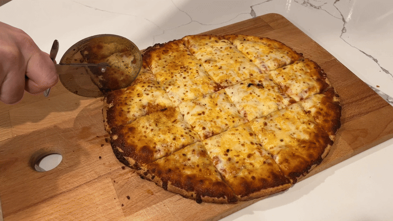 GIF of cutting pizza