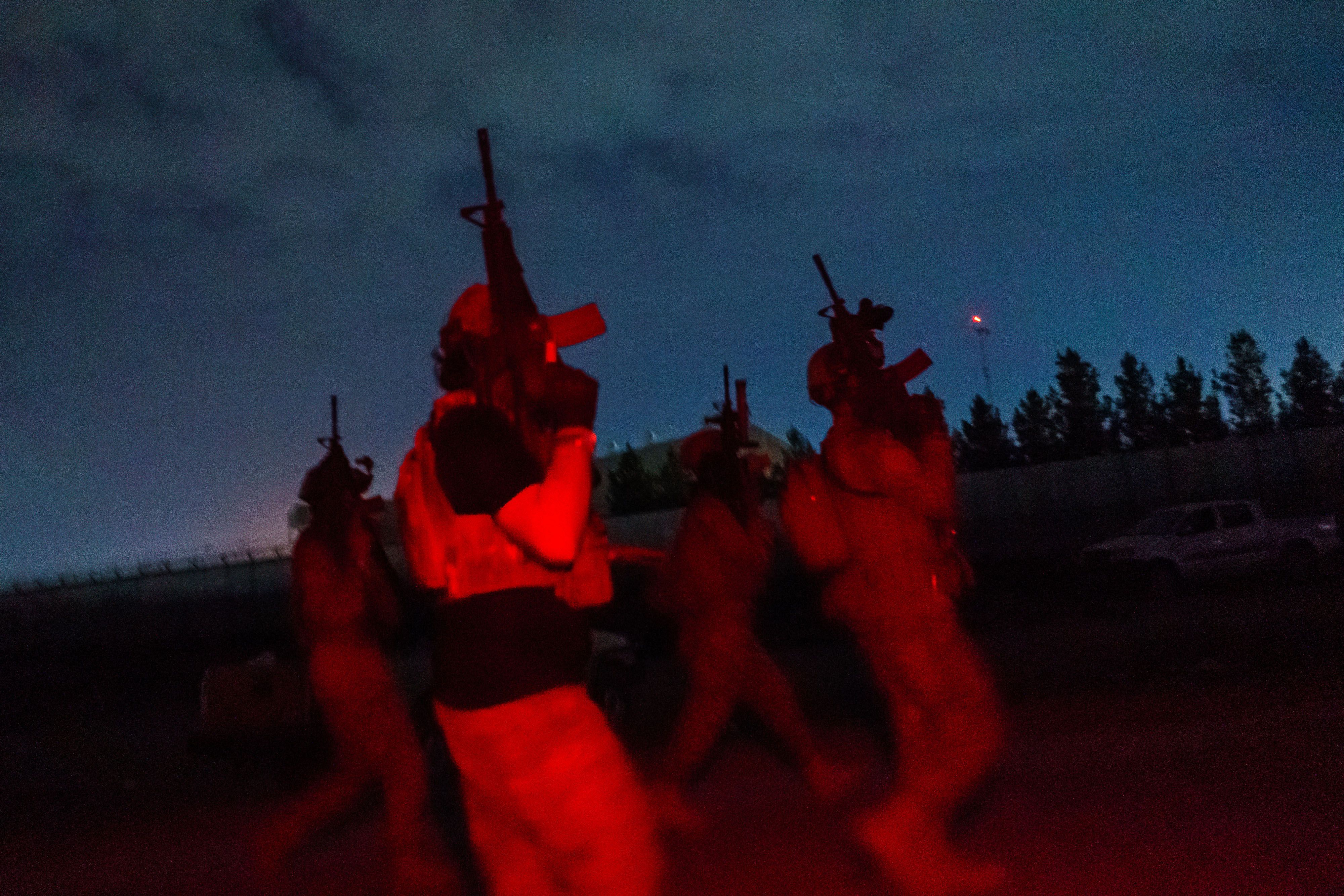 Taliban fighters from the Fateh Zwak unit storm into the Kabul International Airport Tuesday, Aug. 31