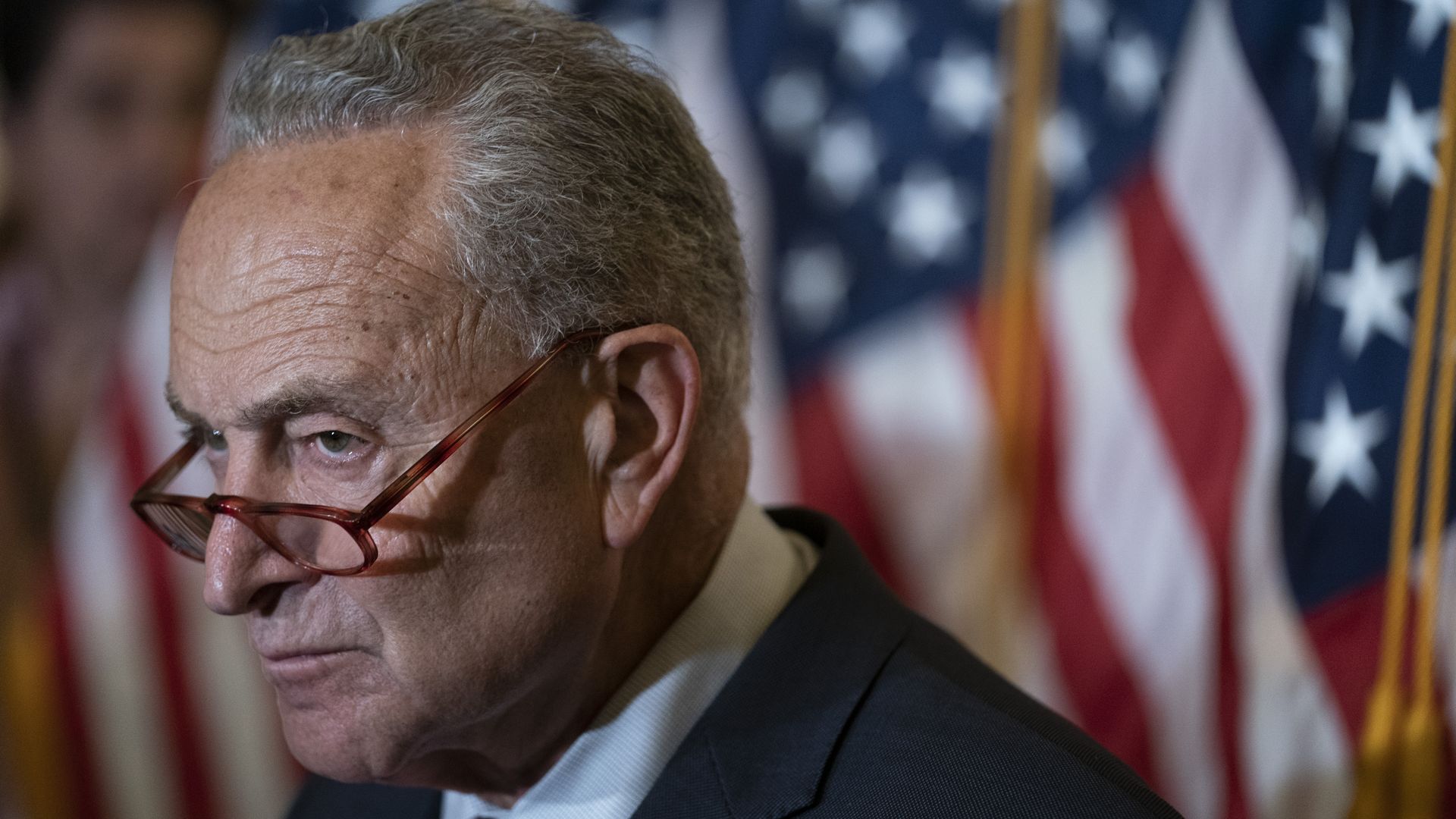 Senate Majority Leader Chuck Schumer, a Democrat from New York, listens during a news conference.