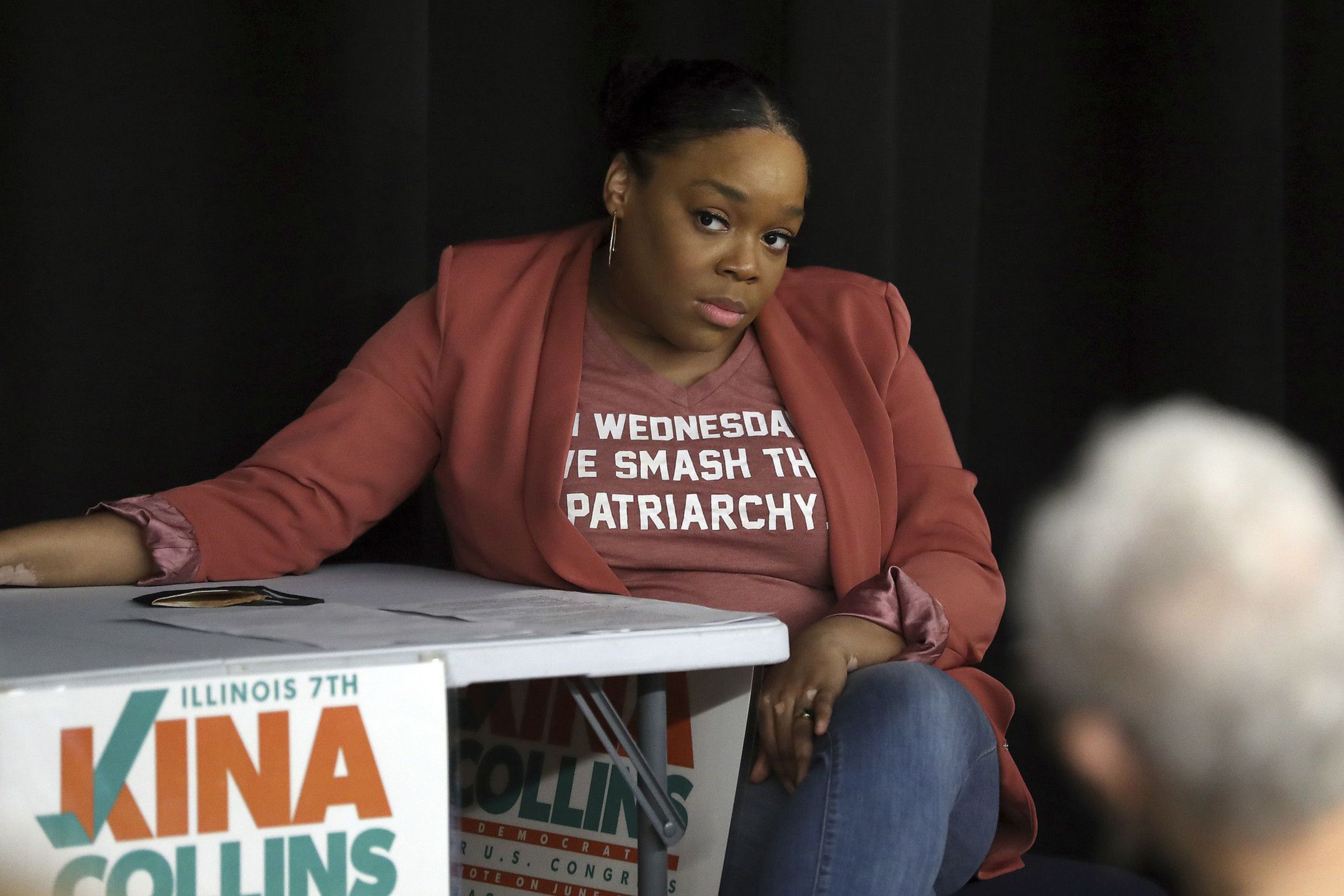 Photo of a woman sitting at a table