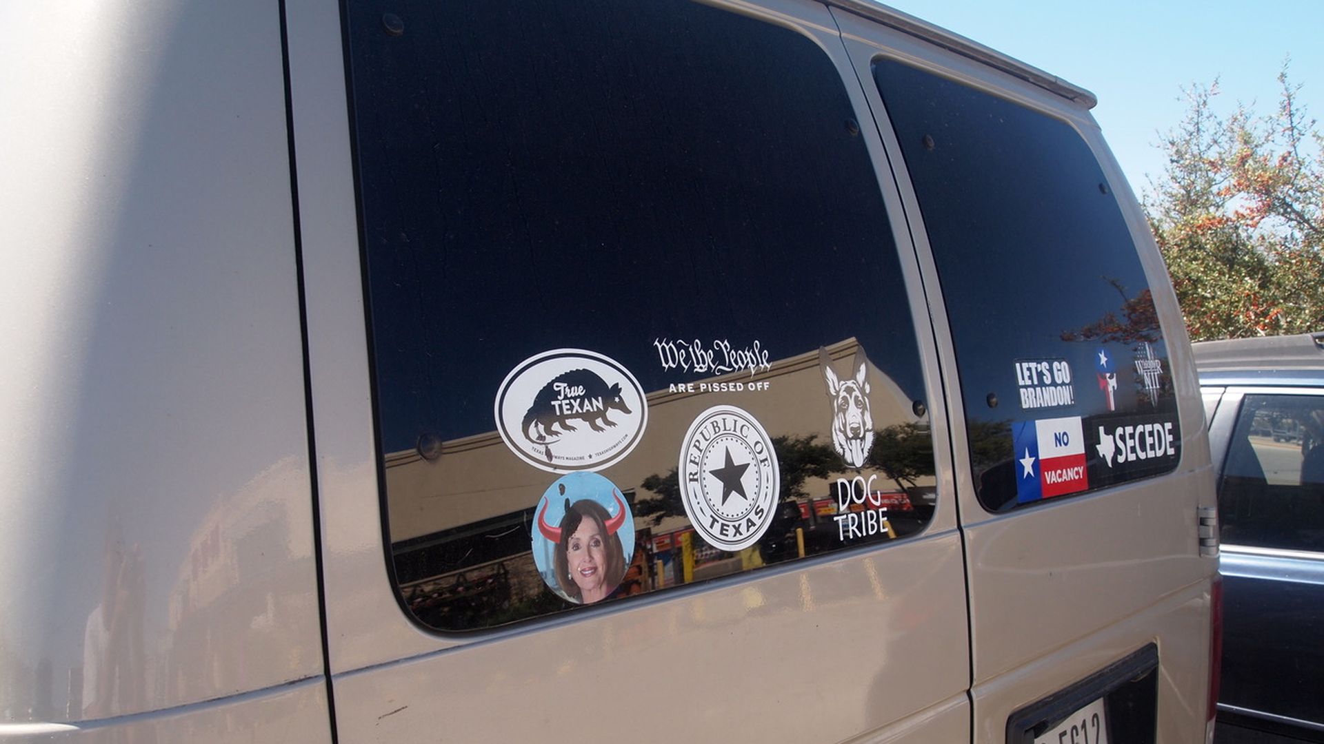 Bumper stickers on the back of a van