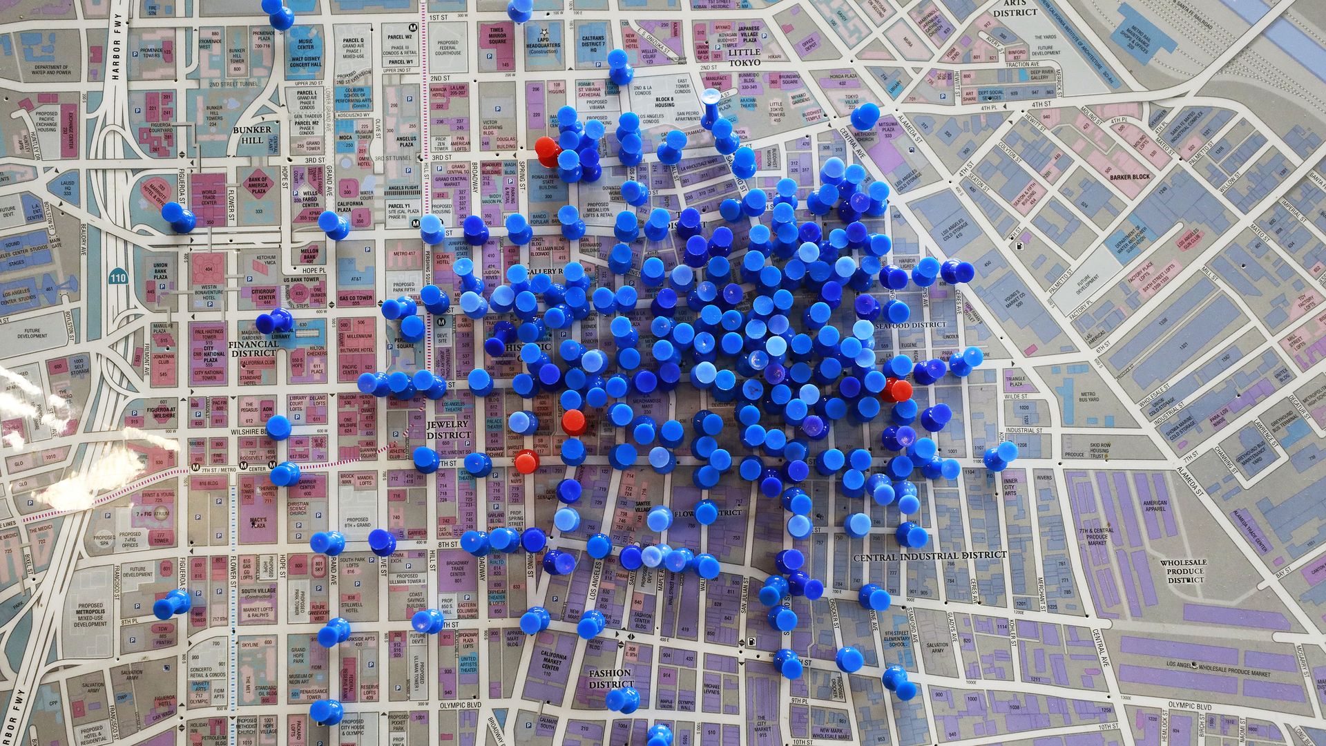 A map of downtown Los Angeles in the city's Center for Harm Reduction with blue pins representing overdose reversal and red pins showing overdose fatalities.