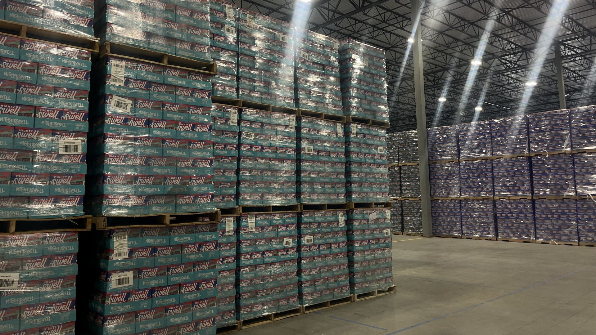 Mighty Swell cans on pallets