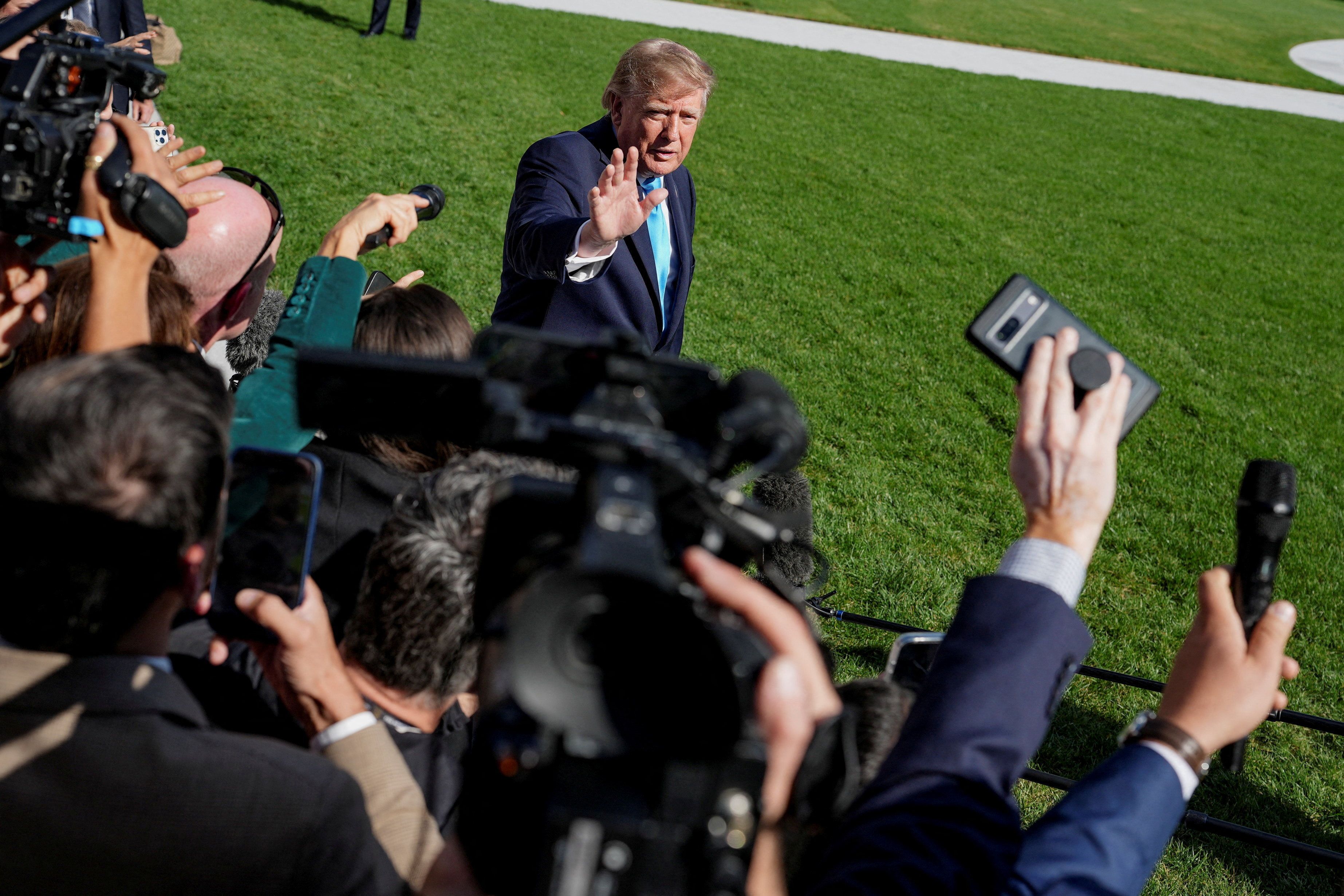 President Trump speaks to reporters on the South Lawn before boarding Marine One on his way to a rally in Grand Island, Neb.