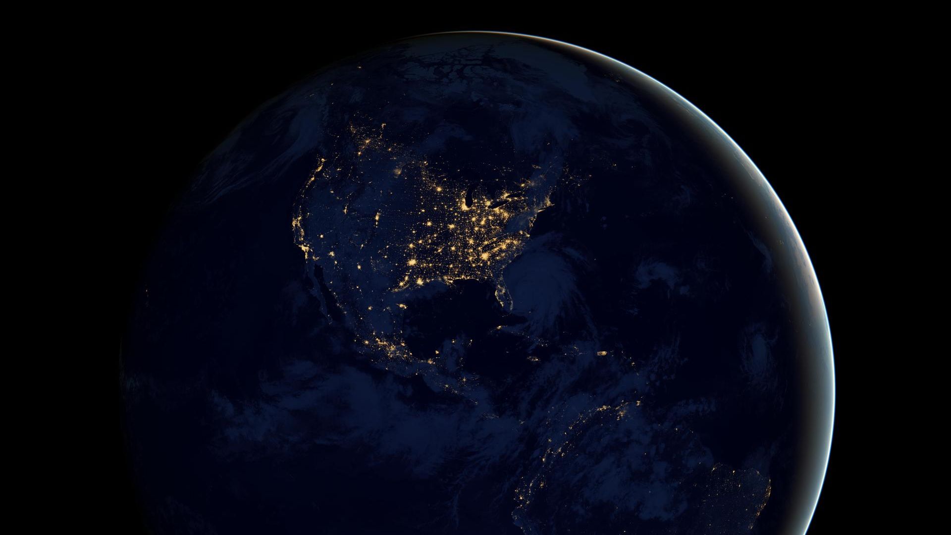 Earth by night with lights dotting the planet as seen from above