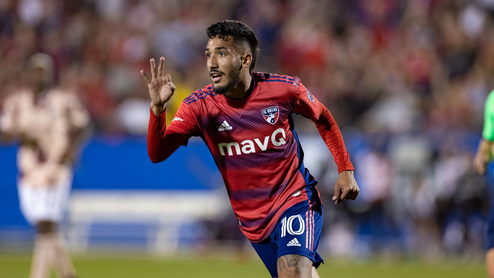 A soccer player celebrating after a goal
