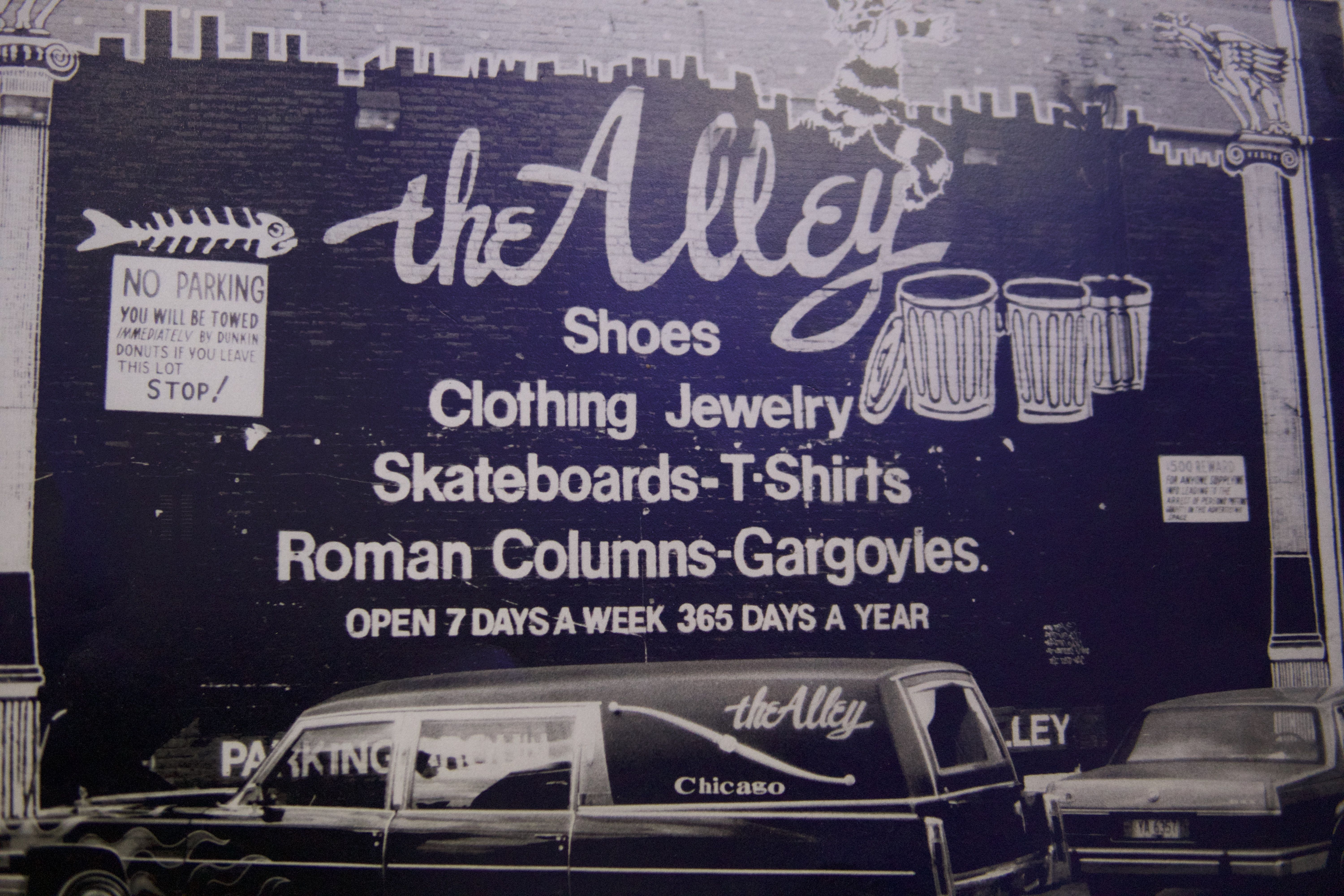 Photo of a painted wall that says "The Alley" 