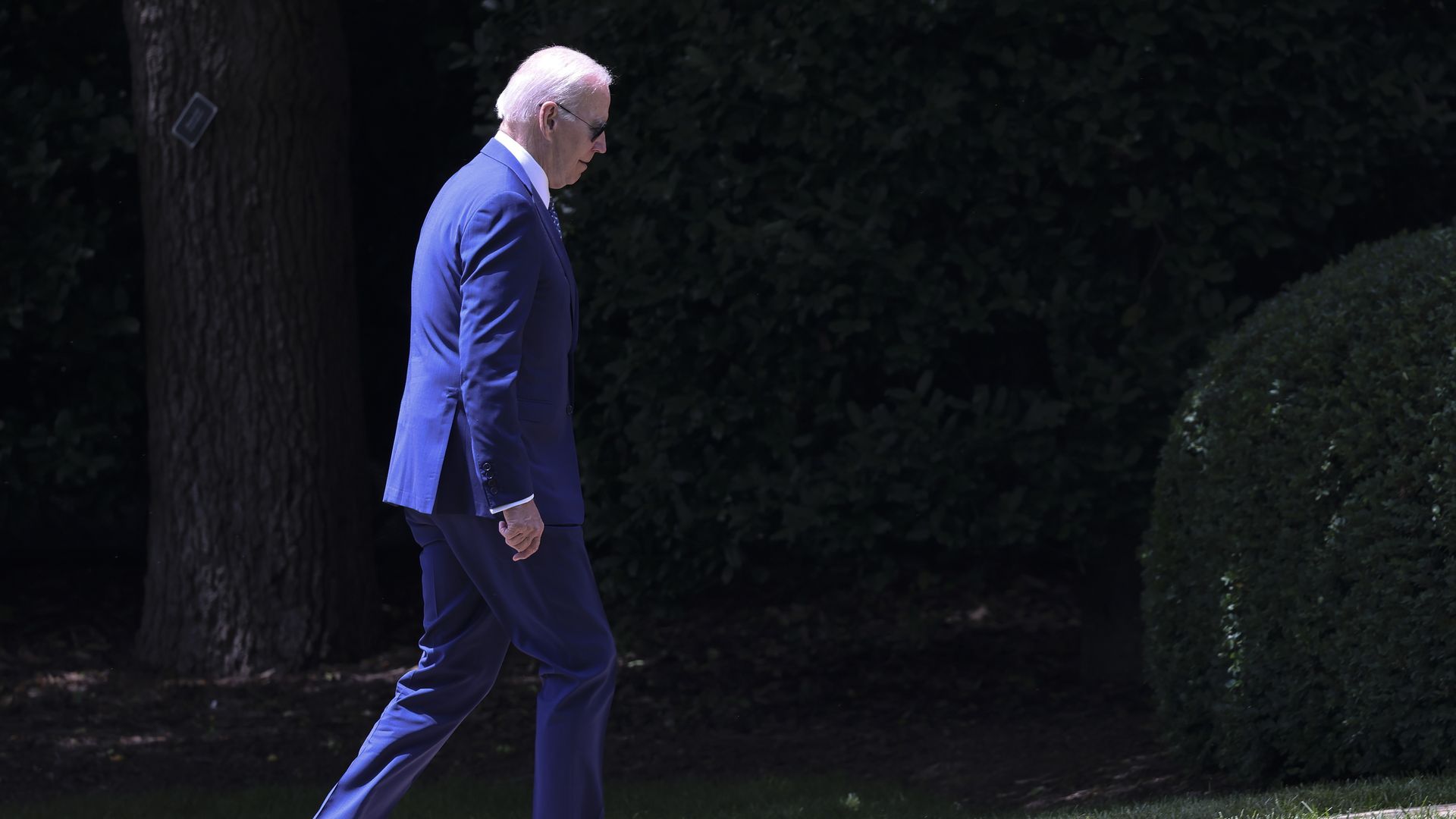 Photo of Joe Biden walking across grass