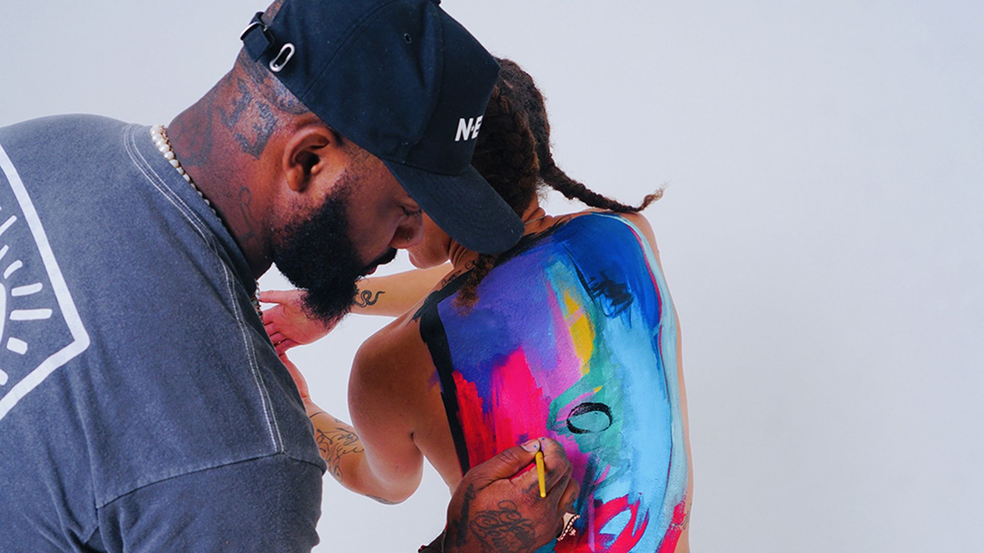 Frankie Zombie painting on fellow artist Makayla Binter. Photo: Atom BLK/courtesy of Frankie Zombie