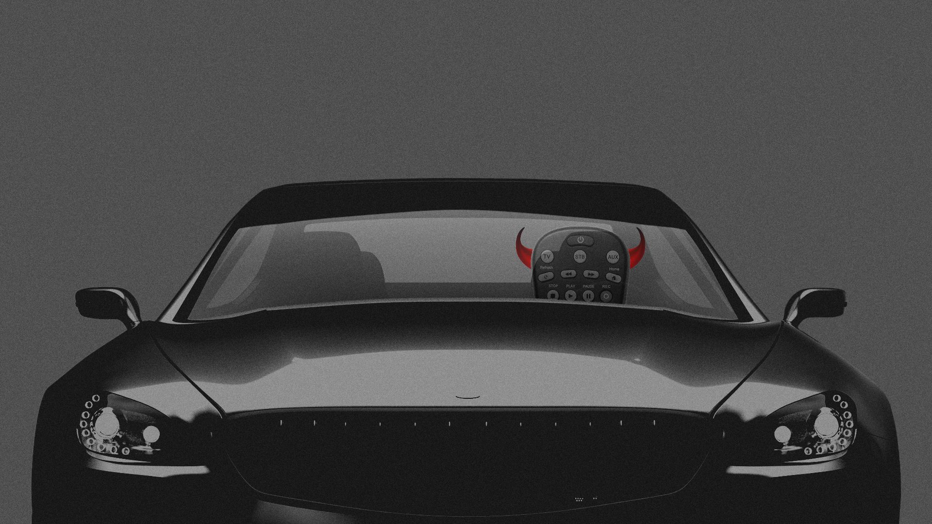 remote control with devil horns driving a car