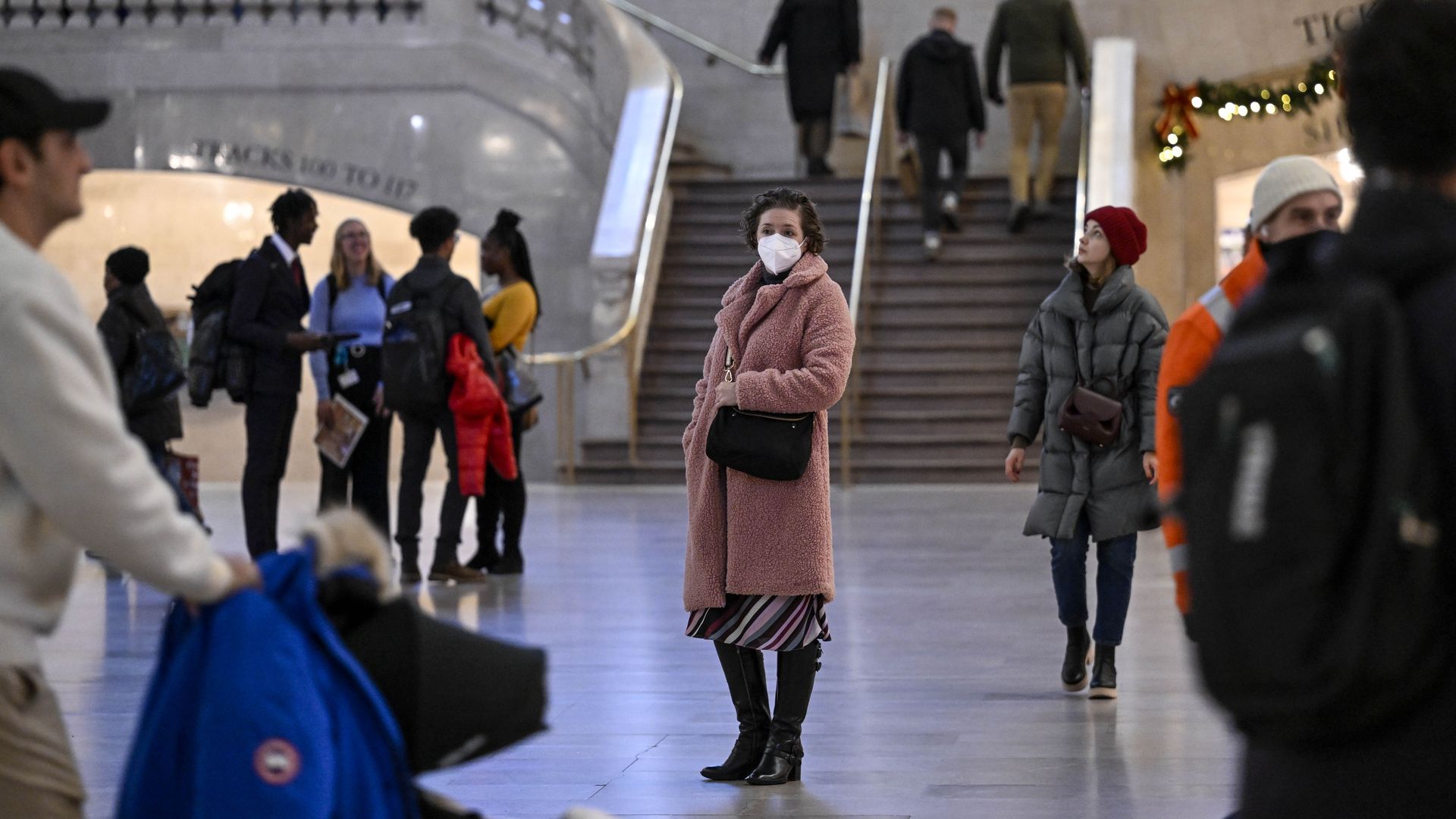People wear mask after New York City's health officials have issued an advisory, strongly urging New Yorkers to use masks as COVID-19, flu, and RSV cases rise, on December 12, 2022 in New York