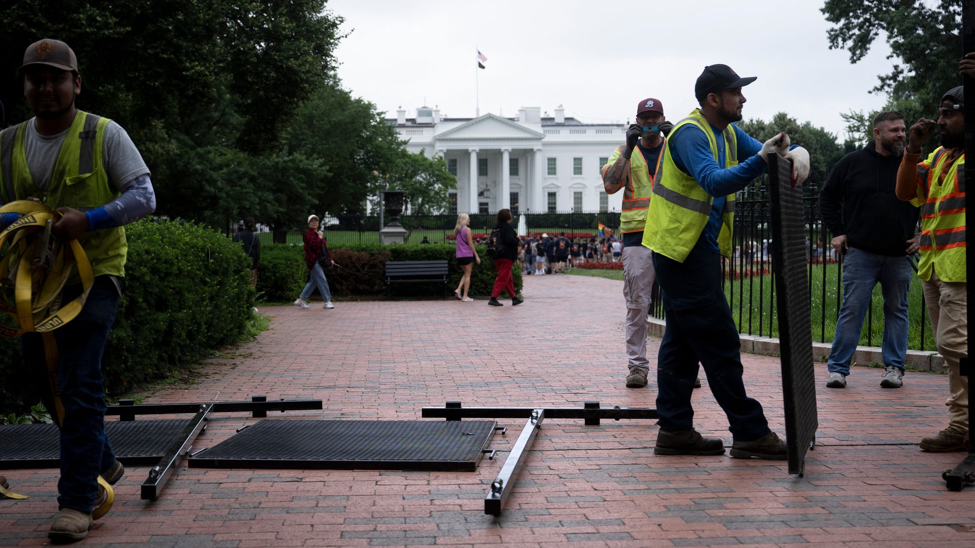 Workers set up fence by the White House