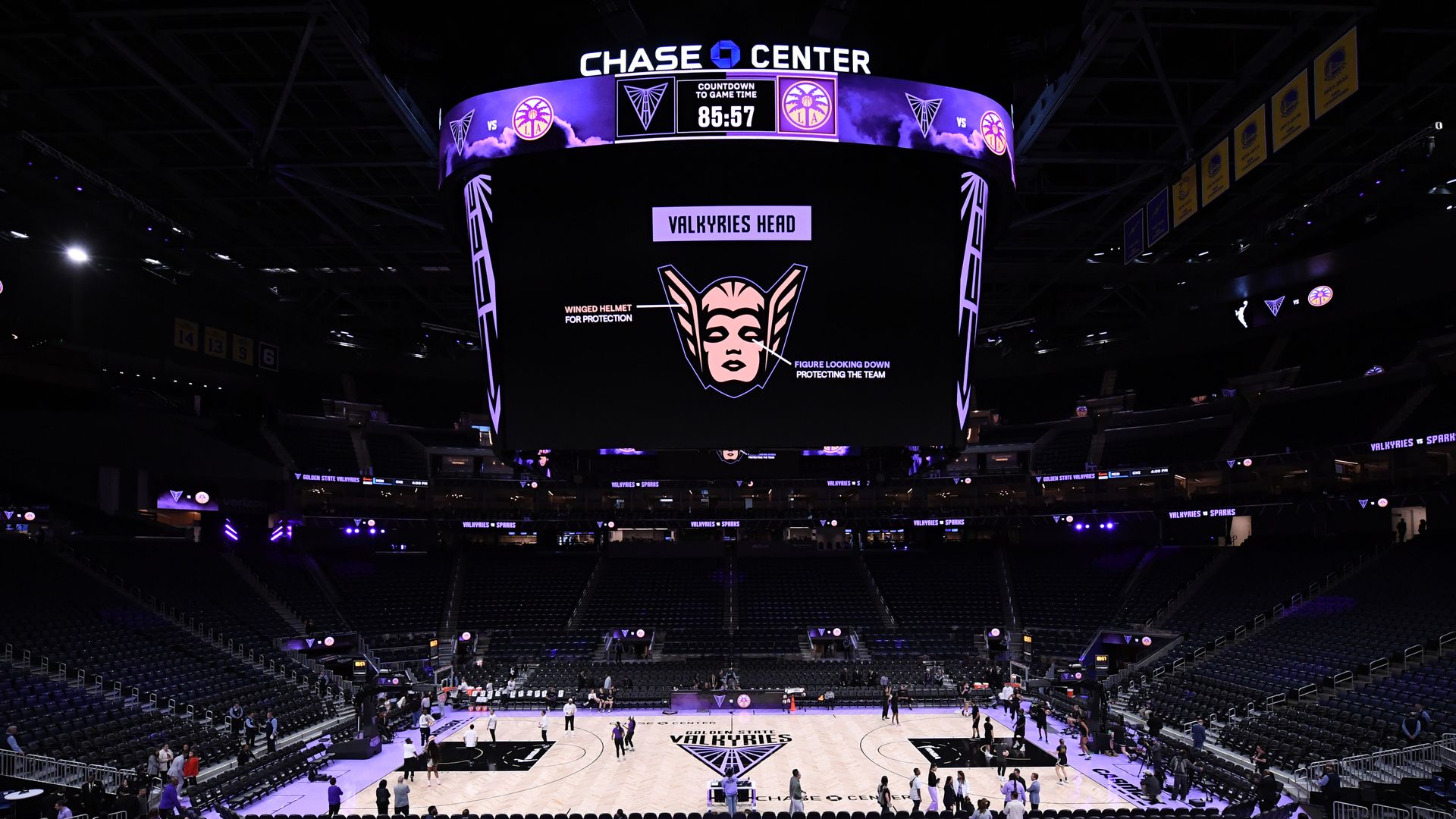 Photo of Chase Center decorated for a Golden State Valkyries game, including a screen that shows the head of a Valkyrie