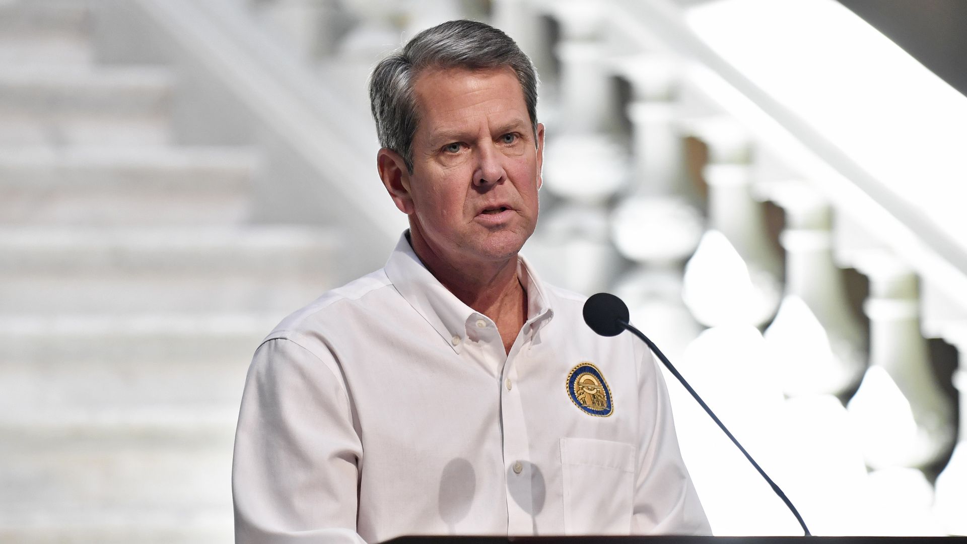 Georgia Gov. Brian Kemp speaks to members of the media
