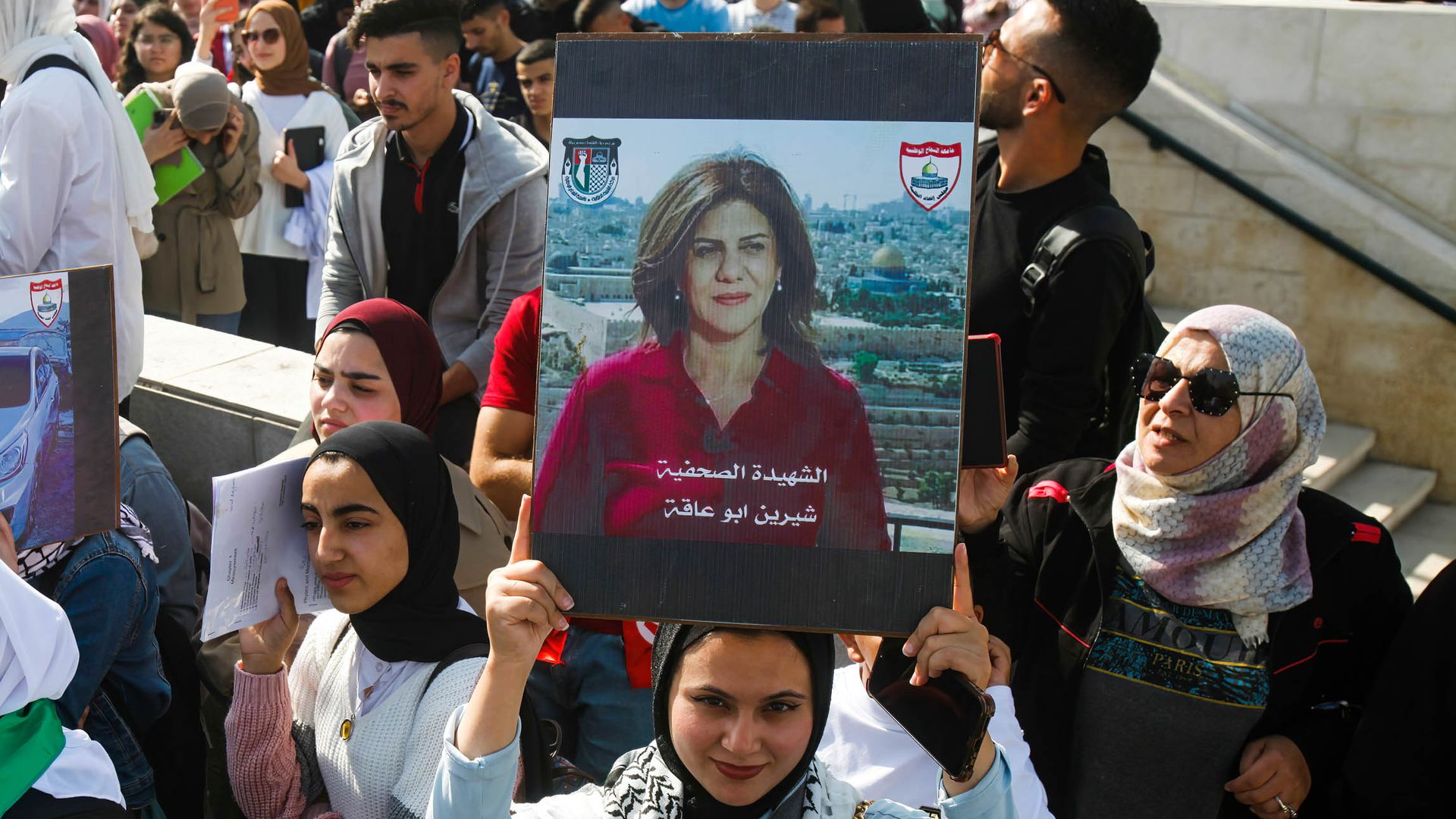A Palestinian student from An-Najah University holds a picture of Shireen Abu Akleh during a protest in the occupied West Bank city of Nablus on Nov. 6.