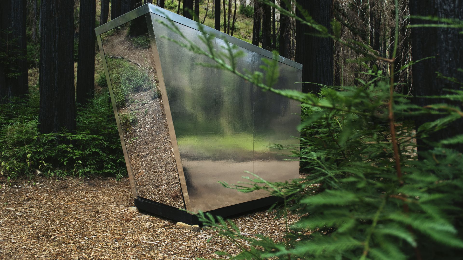 A futuristic-looking, mirrored portable toilet called the Portal.