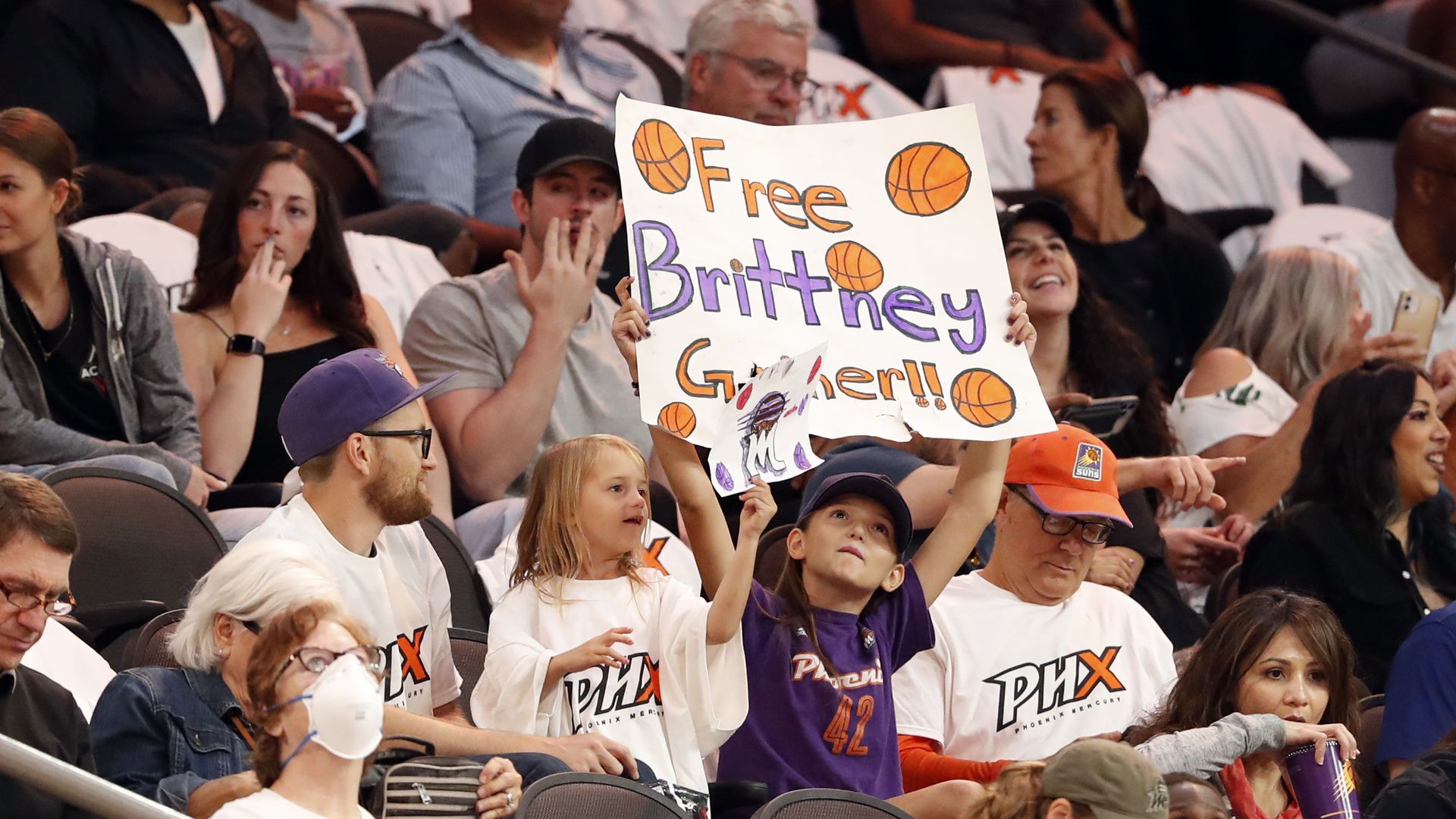 Fans holding a Free Brittney sign