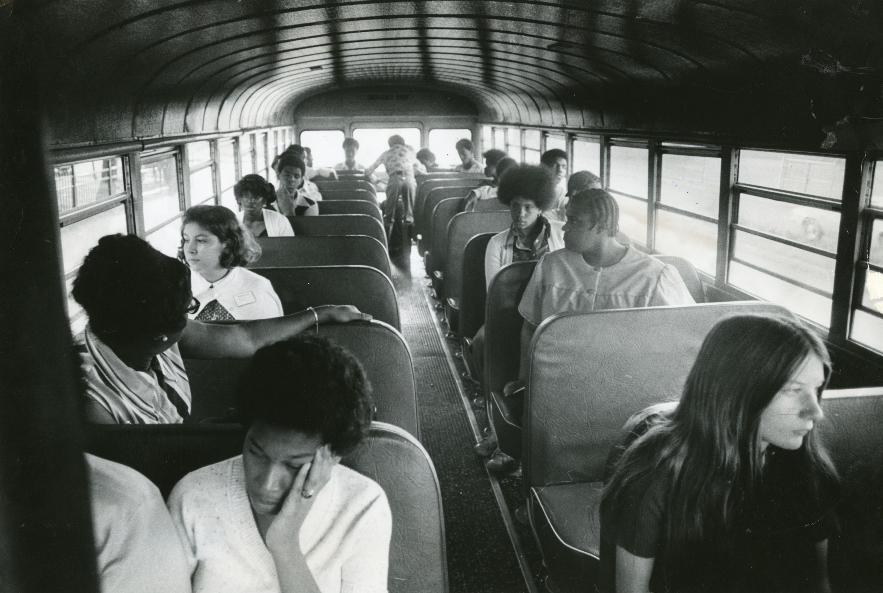 Students sit on a bus going from Columbia Point to Roxbury High School on Sept. 13, 1974, the second day of school under the new busing system put in place to desegregate Boston Public Schools. The system was met with strong resistance from many residents of Boston's neighborhoods. 
