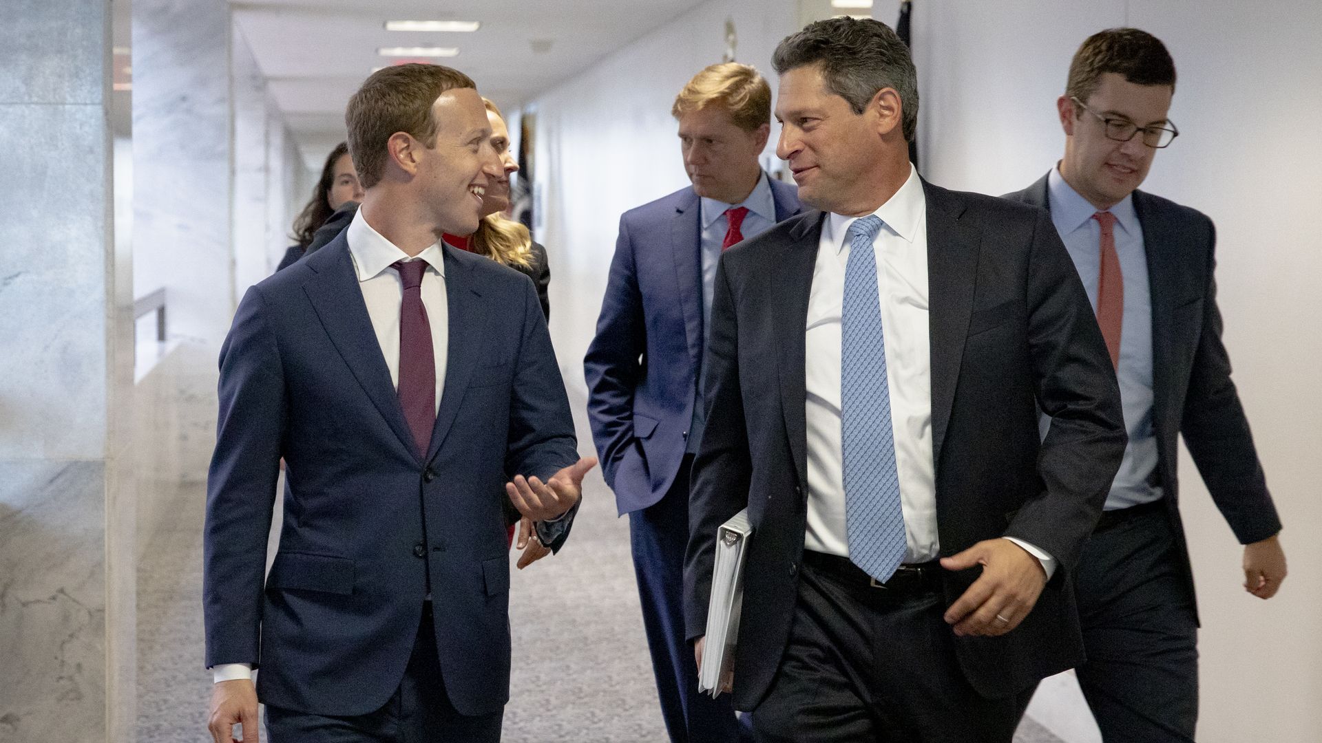 Mark Zuckerberg walks with Joel Kaplan