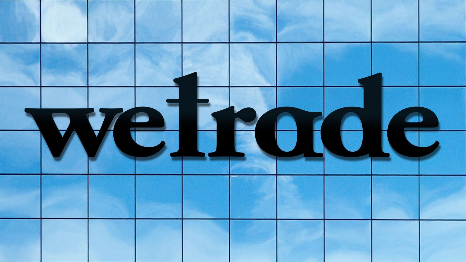 Illustration of the wework on the side of a building logo reading "wetrade"
