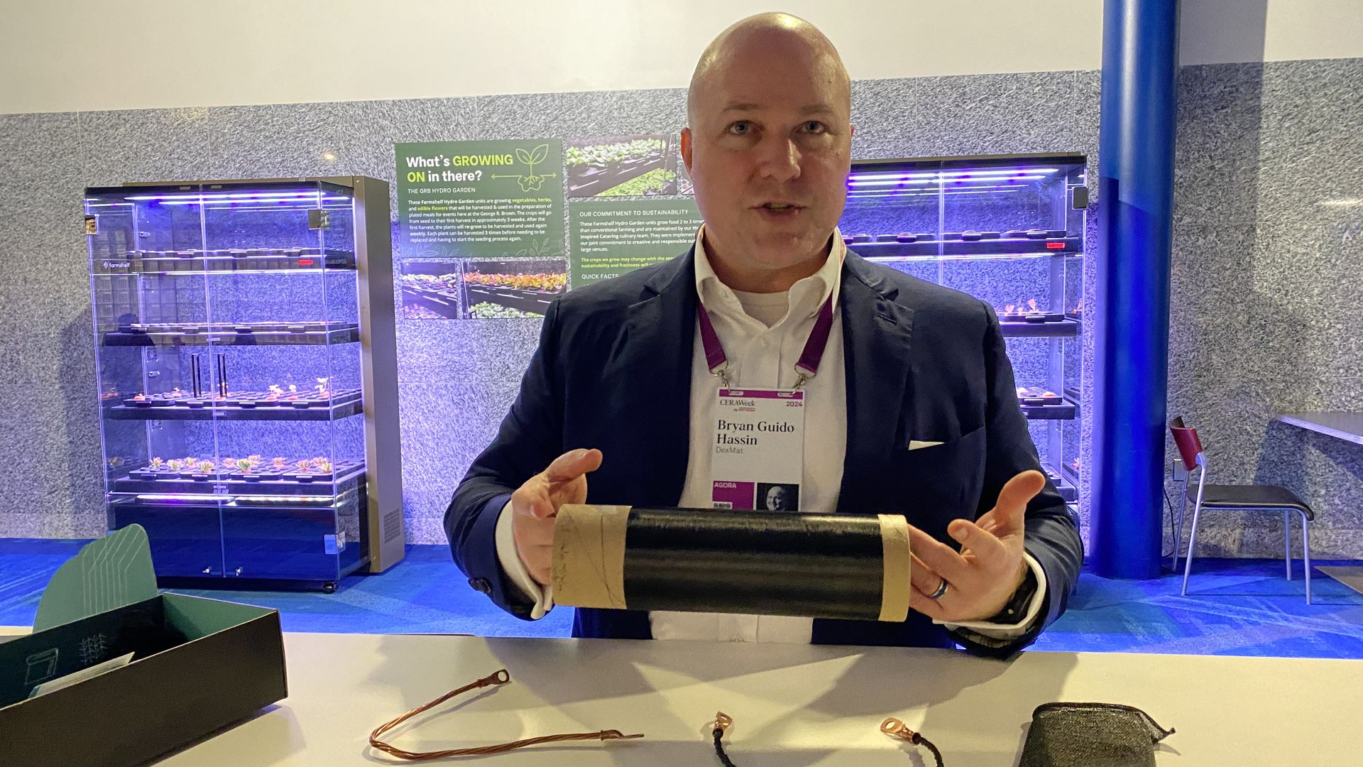 Bryan Guido Hassin, CEO of startup DexMat, holds a roll of his company's woven carbon material.