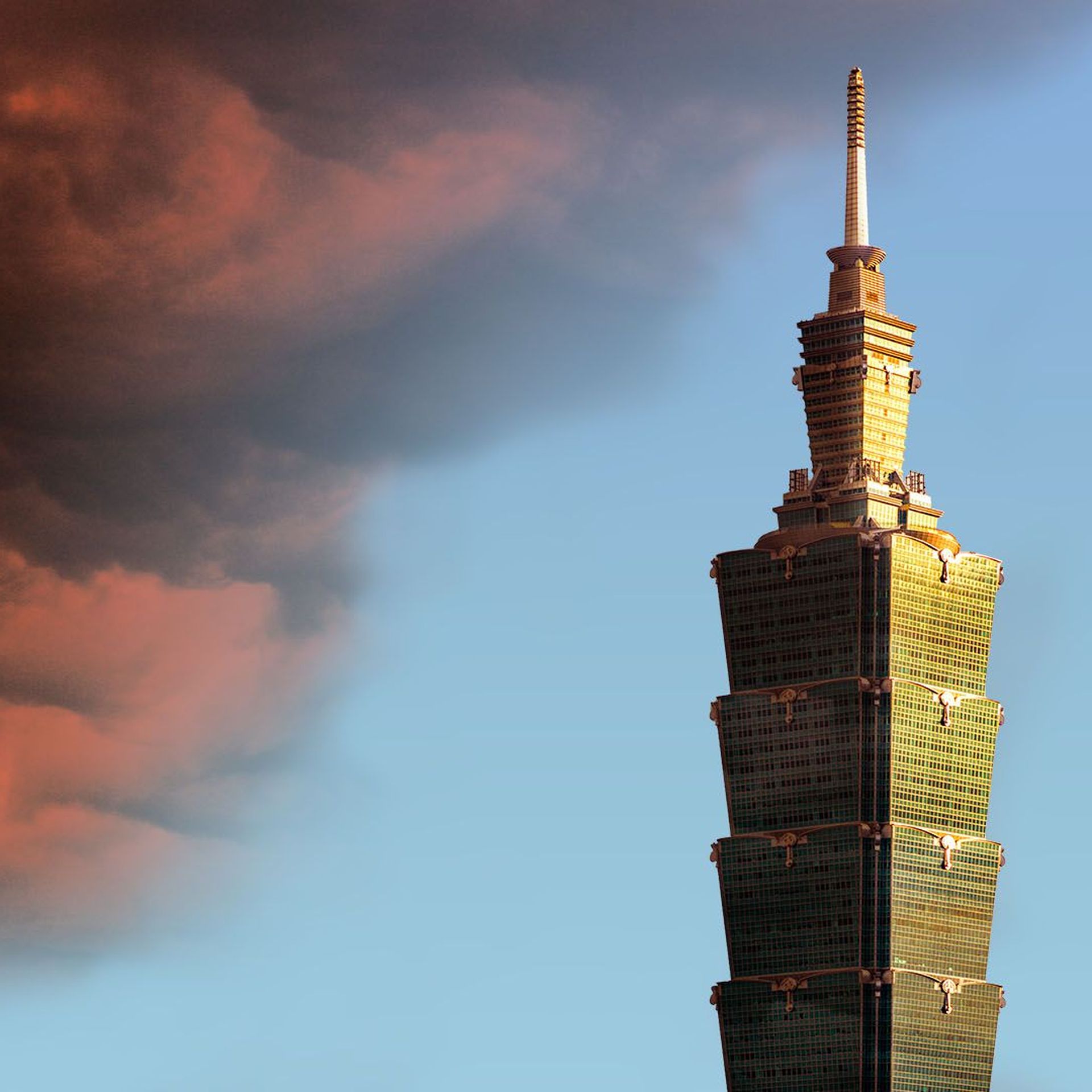 Illustration of the Taipei 101 building with a dark red cloud resembling the Chinese flag approaching