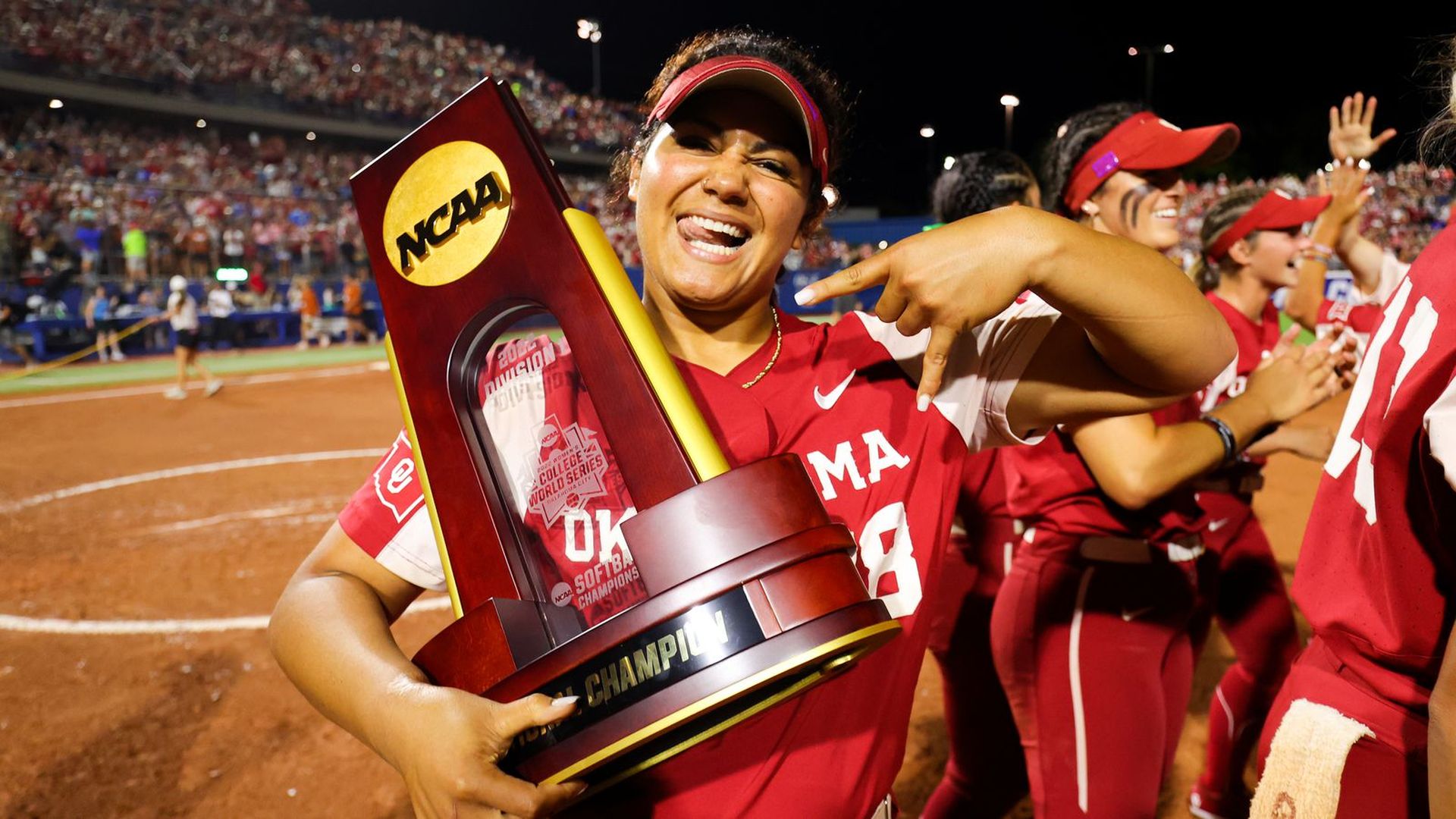 Jocelyn Alo celebrates with the national championship trophy.