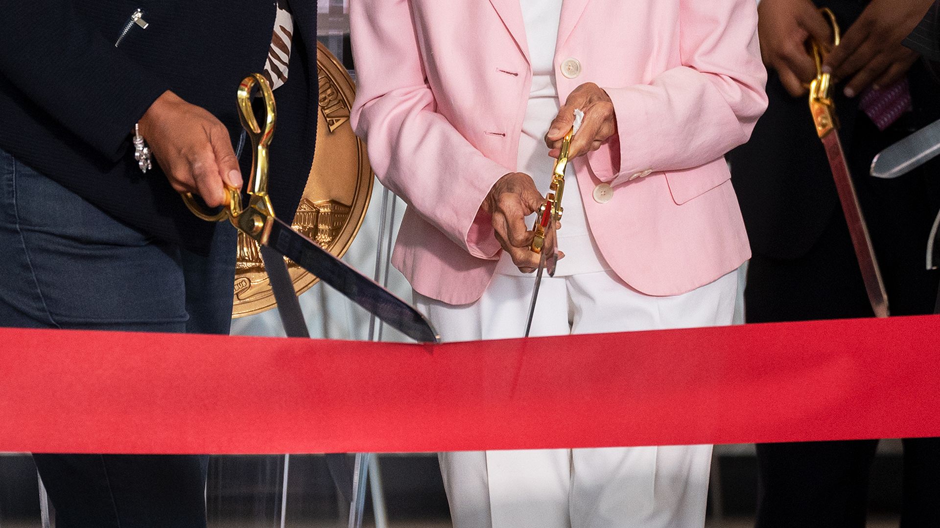 A close up of a ribbon cutting