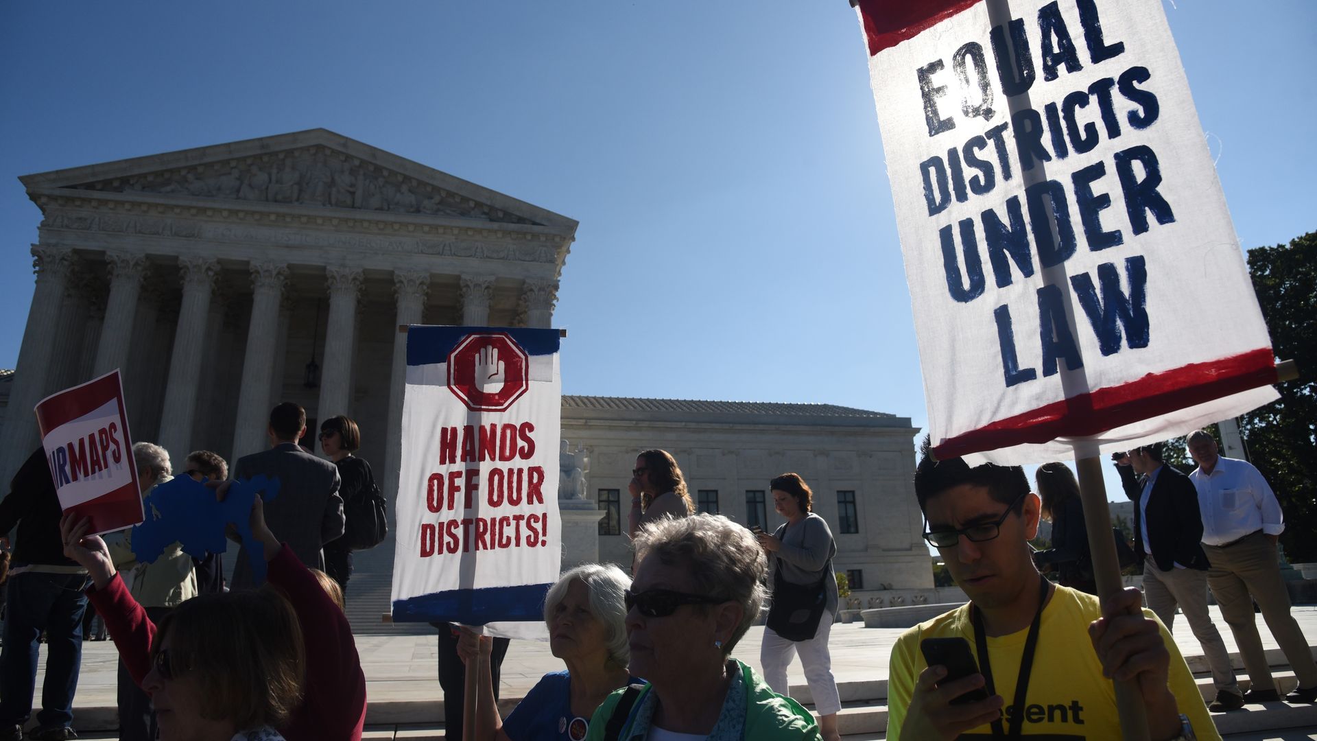 Demonstrators gather outside of The United States Supreme Court during an oral arguments in Gill v. Whitford last October. 