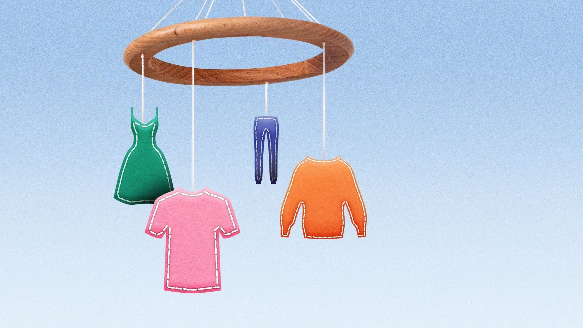 illustration of a nursery mobile with felt clothing hanging from the strings