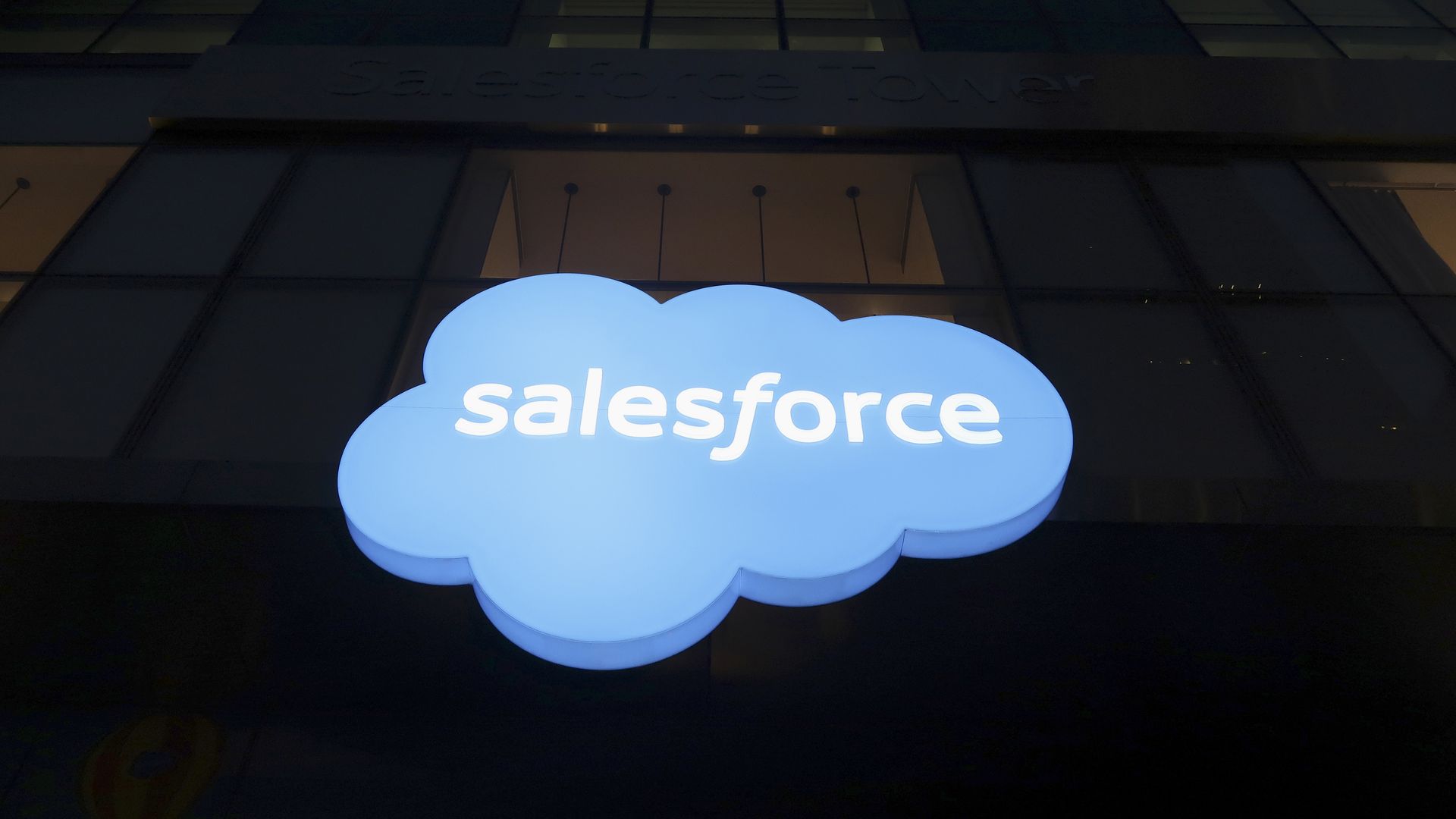 Photo of Salesforce logo on side of a dark building